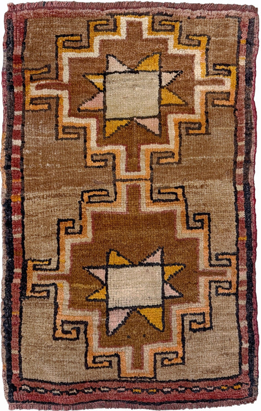 Earthy Vintage Turkish mini rug village rug with warm camel-beige field, stepped geometric star motifs, handmade wool rug measuring approximately 21 x 33 inches. From the best rug shop in SF Bay Area Burlingaöe CA. Free Shipping.