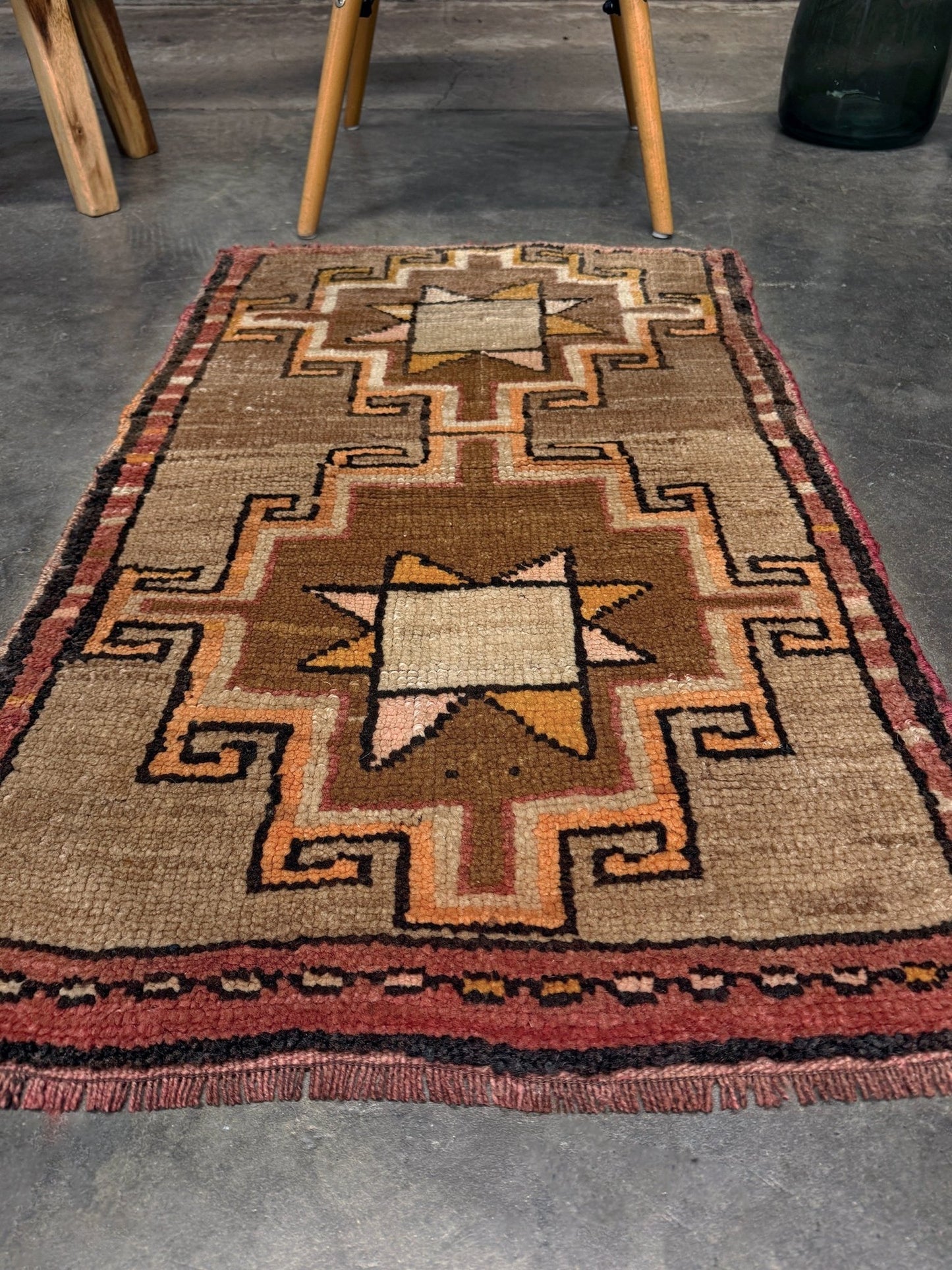 Earthy Vintage Turkish mini rug village rug with warm camel-beige field, stepped geometric star motifs, handmade wool rug measuring approximately 21 x 33 inches. From the best rug shop in SF Bay Area Burlingaöe CA. Free Shipping.
