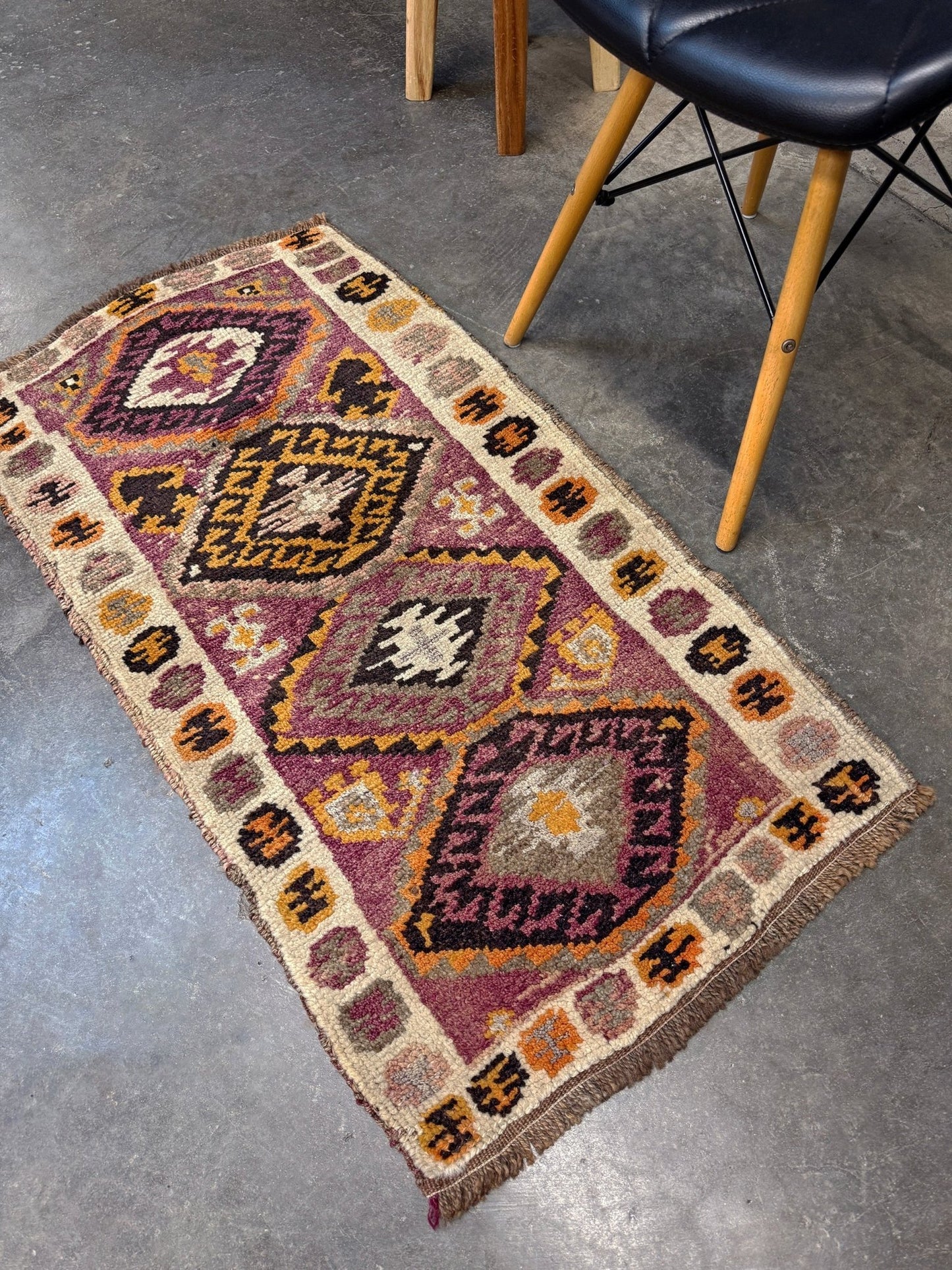 Vintage Turkish Yastik mini rug with earth colors mauve-purple, taupe, and burnt orange. Handmade wool, 2x3 feet. One-of-a-kind rug from Indigo Rugs, the best rug shop in the San Francisco Bay Area (Burlingame, CA). Free shipping included.