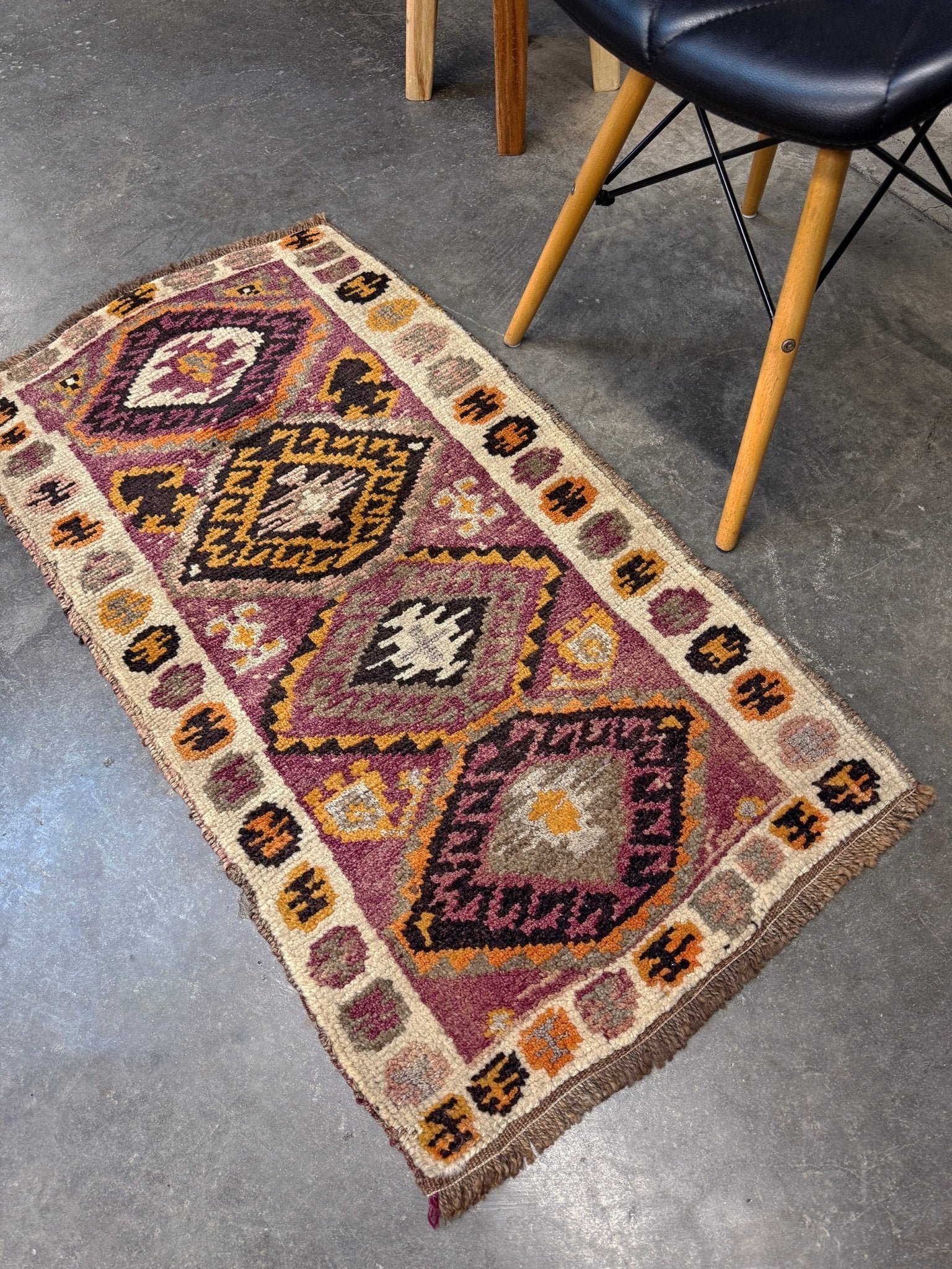 Vintage Turkish Yastik mini rug with earth colors mauve-purple, taupe, and burnt orange. Handmade wool, 2x3 feet. One-of-a-kind rug from Indigo Rugs, the best rug shop in the San Francisco Bay Area (Burlingame, CA). Free shipping included.