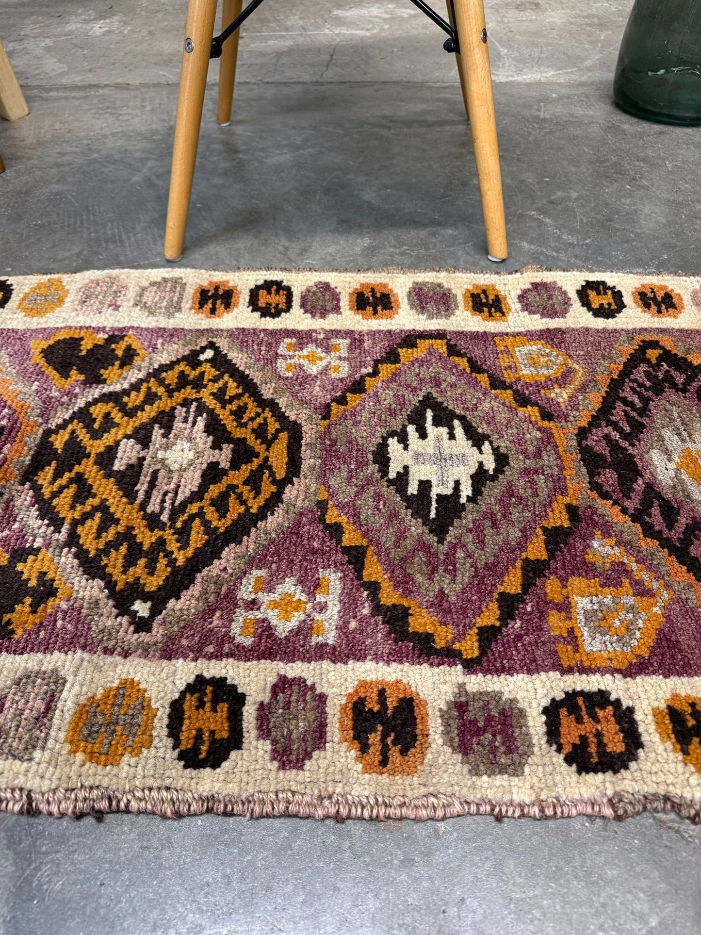 Vintage Turkish Yastik mini rug with earth colors mauve-purple, taupe, and burnt orange. Handmade wool, 2x3 feet. One-of-a-kind rug from Indigo Rugs, the best rug shop in the San Francisco Bay Area (Burlingame, CA). Free shipping included.