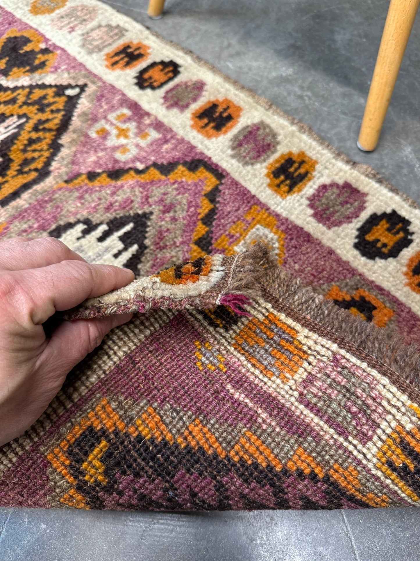 Vintage Turkish Yastik mini rug with earth colors mauve-purple, taupe, and burnt orange. Handmade wool, 2x3 feet. One-of-a-kind rug from Indigo Rugs, the best rug shop in the San Francisco Bay Area (Burlingame, CA). Free shipping included.