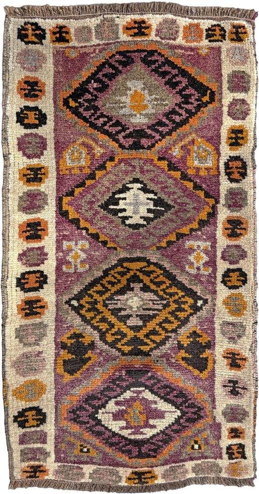 Vintage Turkish Yastik mini rug with earth colors mauve-purple, taupe, and burnt orange. Handmade wool, 2x3 feet. One-of-a-kind rug from Indigo Rugs, the best rug shop in the San Francisco Bay Area (Burlingame, CA). Free shipping included.