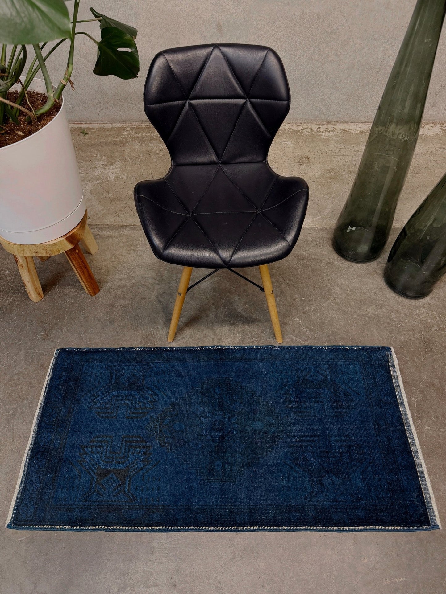 Turkish overdyed Yastik rug in deep indigo and midnight blue, with subtle tribal motifs visible beneath the saturated overdye. Hand-knotted wool, 20x40 inches. One-of-a-kind piece from Indigo Rugs, the best rug shop in the San Francisco Bay Area (Burlingame, CA). Free shipping included.