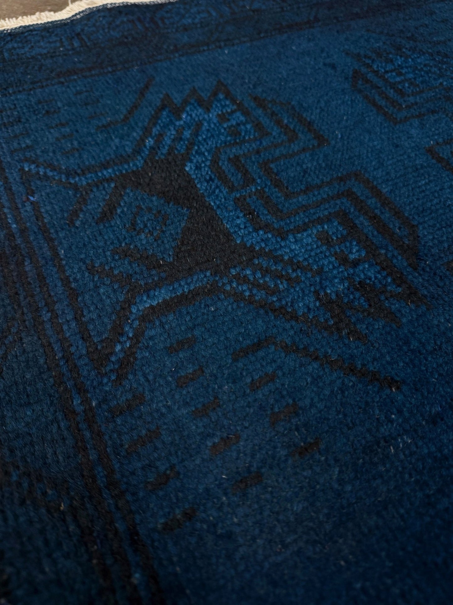 Turkish overdyed Yastik rug in deep indigo and midnight blue, with subtle tribal motifs visible beneath the saturated overdye. Hand-knotted wool, 20x40 inches. One-of-a-kind piece from Indigo Rugs, the best rug shop in the San Francisco Bay Area (Burlingame, CA). Free shipping included.