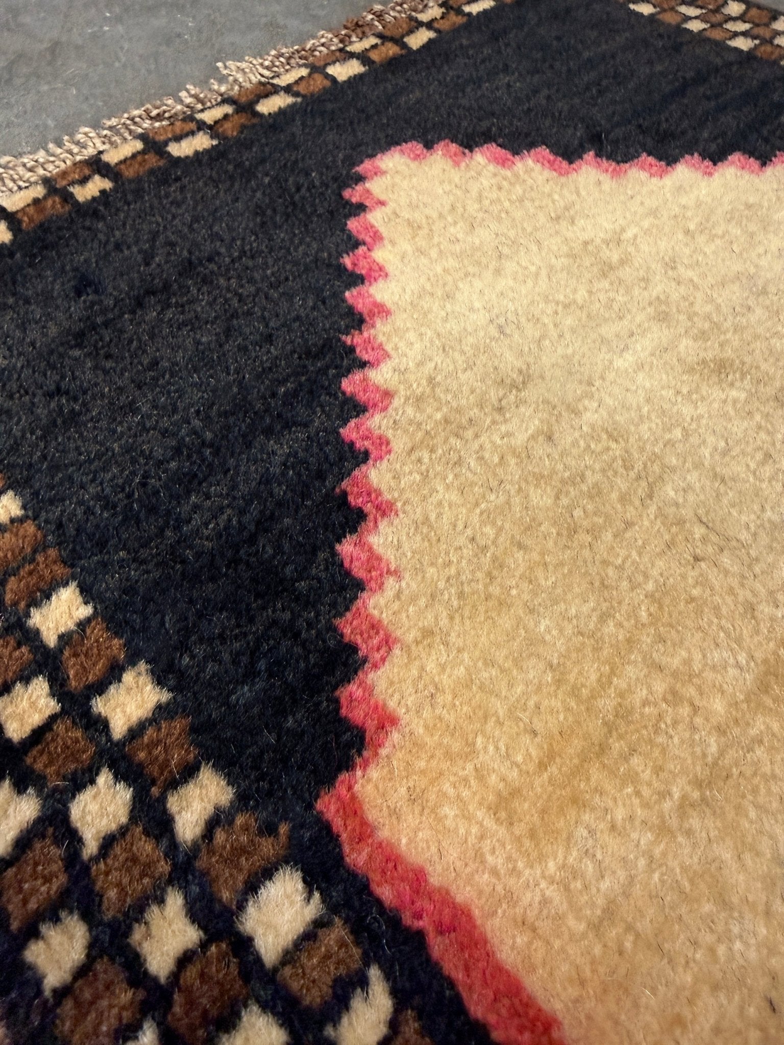 Neurtal Vintage Turkish mini rug 2x3, perfect for entryways, bedside, or layered décor. with a soft ivory field and bold geometric medallion in warm brown tones, framed by a deep cocoa-brown border with subtle brick-red accents. Handmade Anatolian wool rug,  From Indigo Rugs, Burlingame, San Francisco Bay Area.