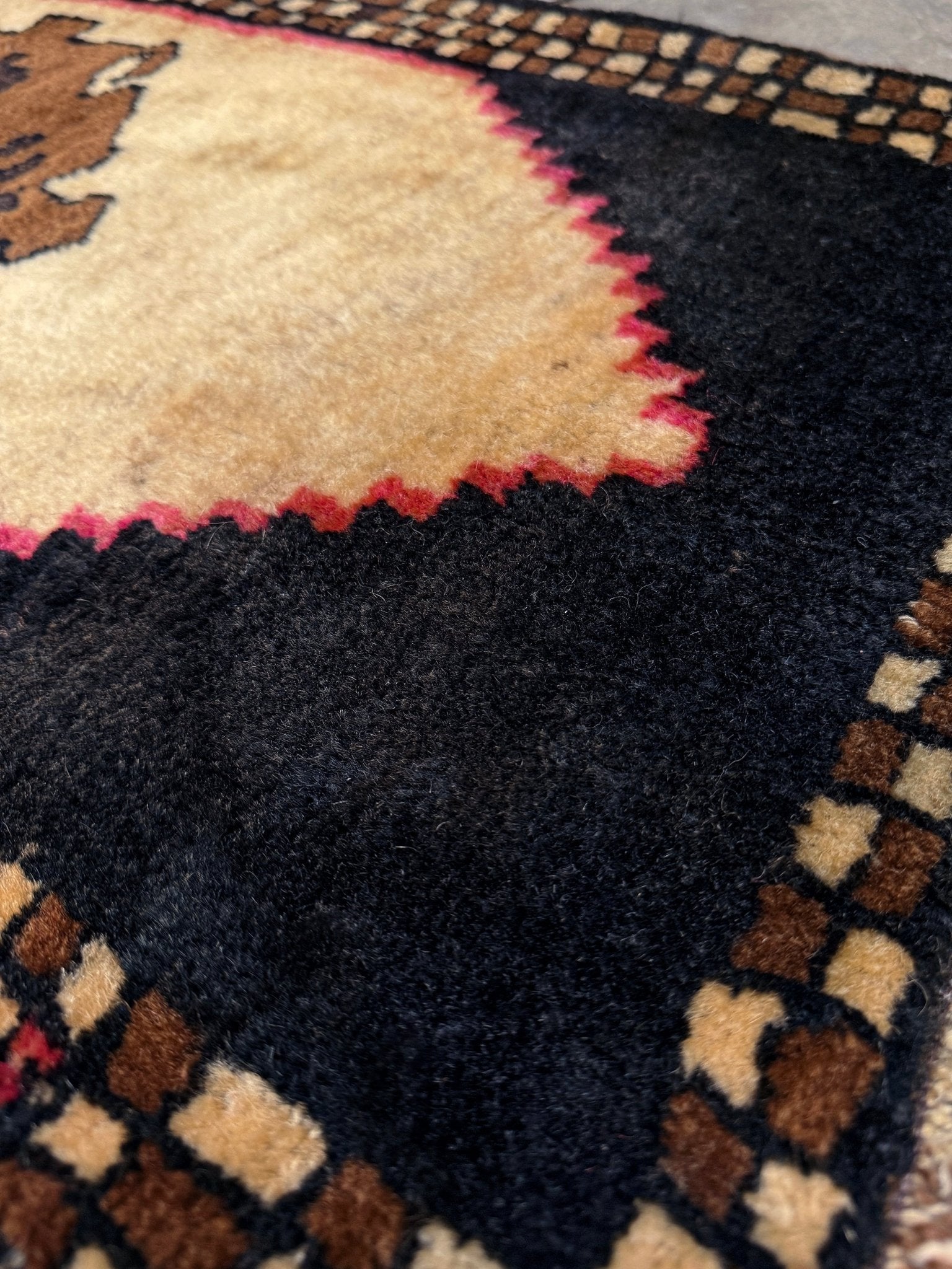 Neurtal Vintage Turkish mini rug 2x3, perfect for entryways, bedside, or layered décor. with a soft ivory field and bold geometric medallion in warm brown tones, framed by a deep cocoa-brown border with subtle brick-red accents. Handmade Anatolian wool rug,  From Indigo Rugs, Burlingame, San Francisco Bay Area.