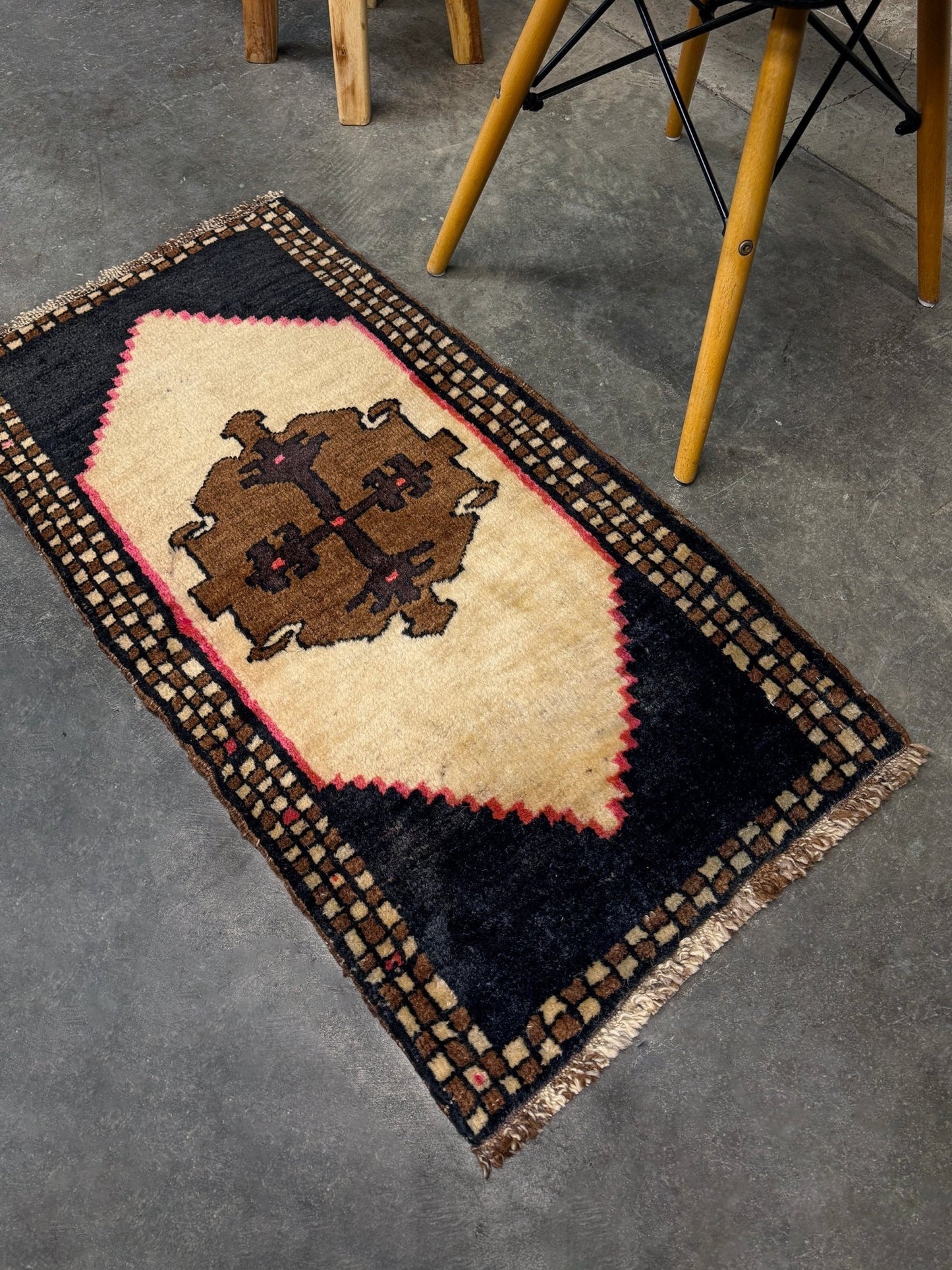 Neurtal Vintage Turkish mini rug 2x3, perfect for entryways, bedside, or layered décor. with a soft ivory field and bold geometric medallion in warm brown tones, framed by a deep cocoa-brown border with subtle brick-red accents. Handmade Anatolian wool rug,  From Indigo Rugs, Burlingame, San Francisco Bay Area.