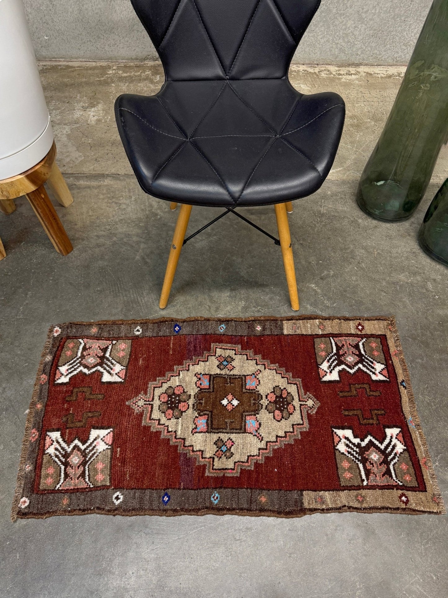 Vintage Turkish Yastik mini rug in chestnut brown with espresso outlines, camel-brown medallion, ivory highlights, muted blush and turquoise floral accents. Hand-knotted wool, 19x37 inches. One-of-a-kind vintage piece from the best rug shop in the San Francisco Bay Area, Indigo Rugs in Burlingame, CA. Free shipping included.