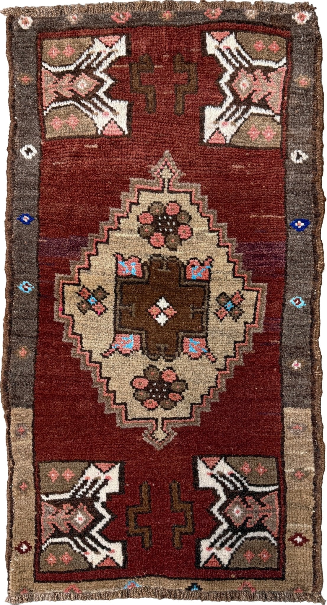 Vintage Turkish Yastik mini rug in chestnut brown with espresso outlines, camel-brown medallion, ivory highlights, muted blush and turquoise floral accents. Hand-knotted wool, 19x37 inches. One-of-a-kind vintage piece from the best rug shop in the San Francisco Bay Area, Indigo Rugs in Burlingame, CA. Free shipping included.