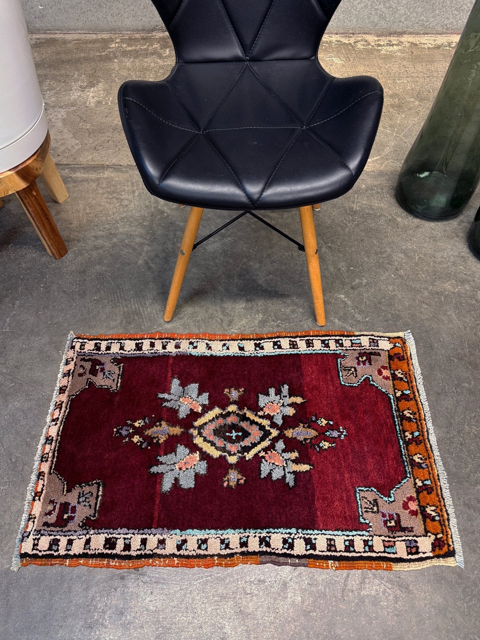 Vintage Turkish Yastik mini rug in ruby red. Hand-knotted wool, 20x33. One-of-a-kind rug from Indigo Rugs, the best rug shop in the San Francisco Bay Area (Burlingame, CA). Free shipping included.
