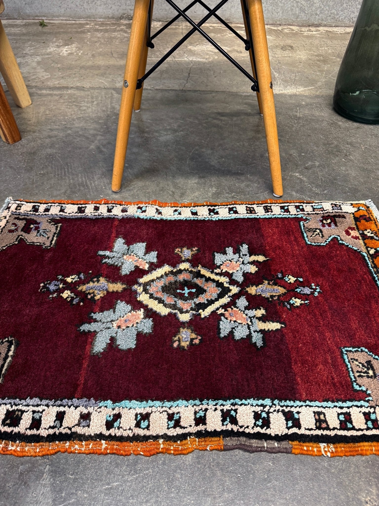 Vintage Turkish Yastik mini rug in ruby red. Hand-knotted wool, 20x33. One-of-a-kind rug from Indigo Rugs, the best rug shop in the San Francisco Bay Area (Burlingame, CA). Free shipping included.