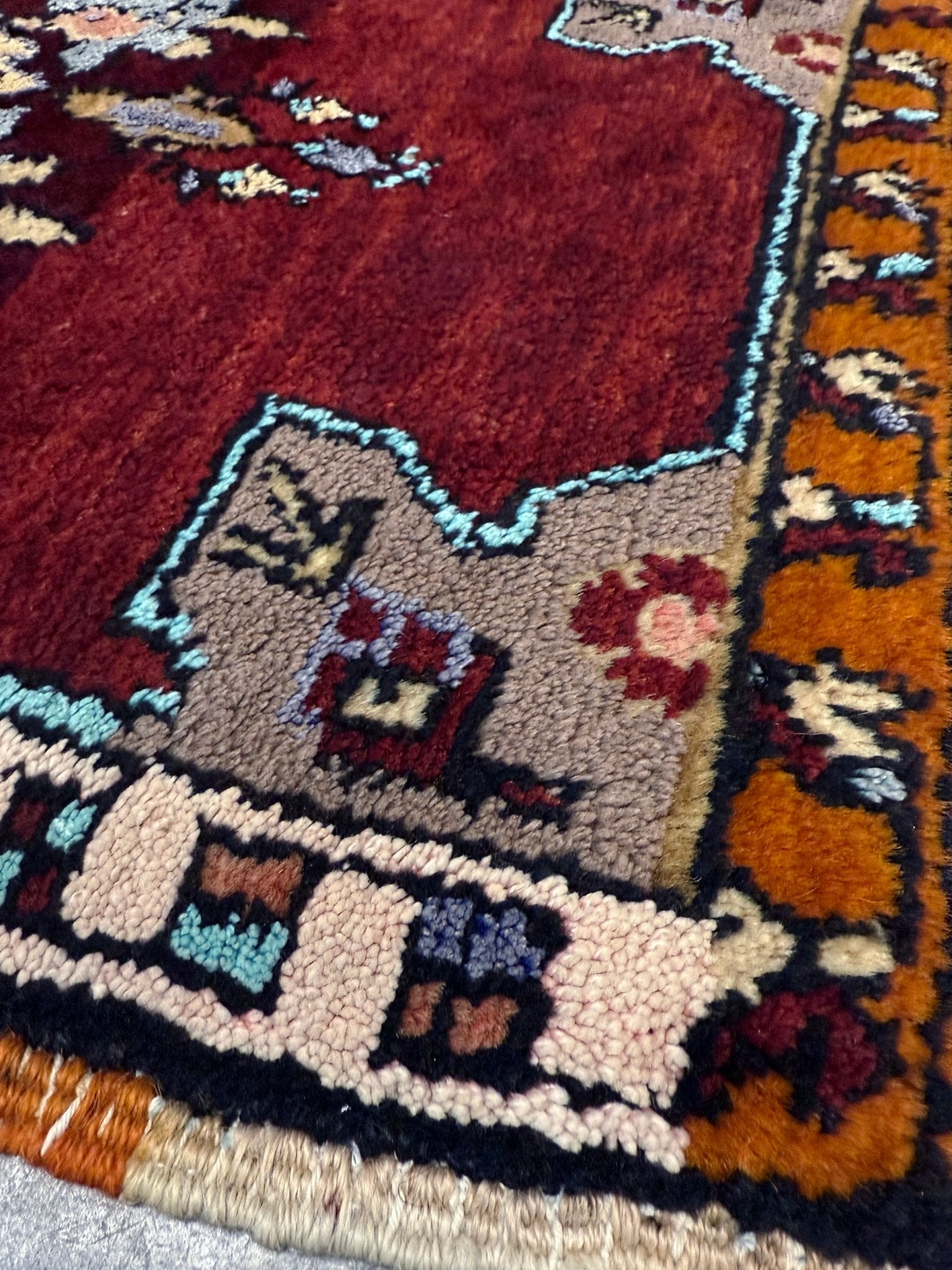 Vintage Turkish Yastik mini rug in ruby red. Hand-knotted wool, 20x33. One-of-a-kind rug from Indigo Rugs, the best rug shop in the San Francisco Bay Area (Burlingame, CA). Free shipping included.