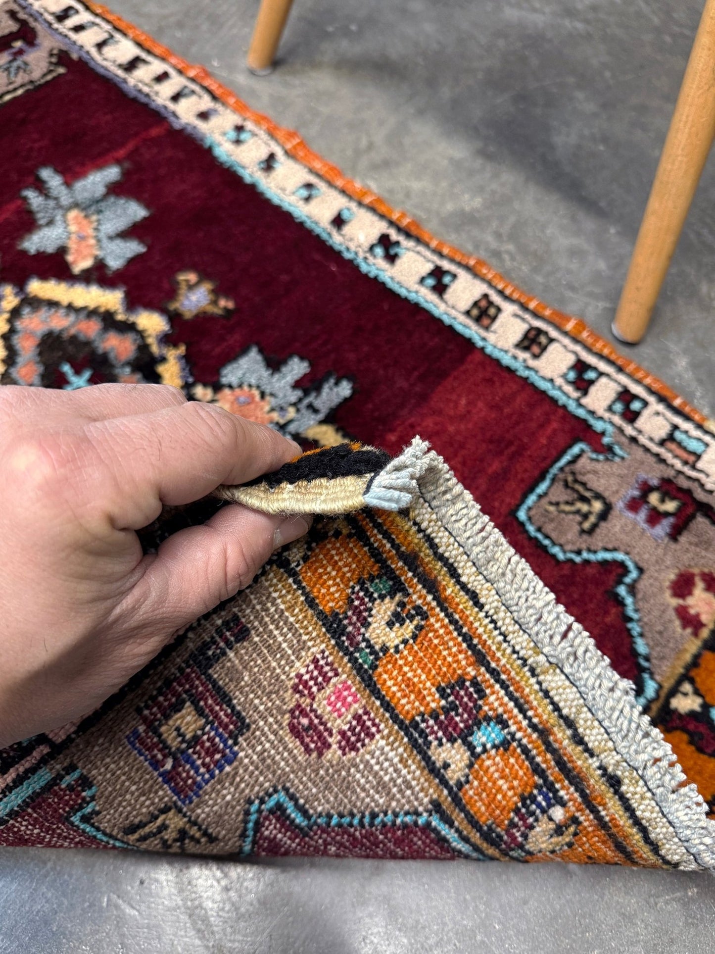 Vintage Turkish Yastik mini rug in ruby red. Hand-knotted wool, 20x33. One-of-a-kind rug from Indigo Rugs, the best rug shop in the San Francisco Bay Area (Burlingame, CA). Free shipping included.