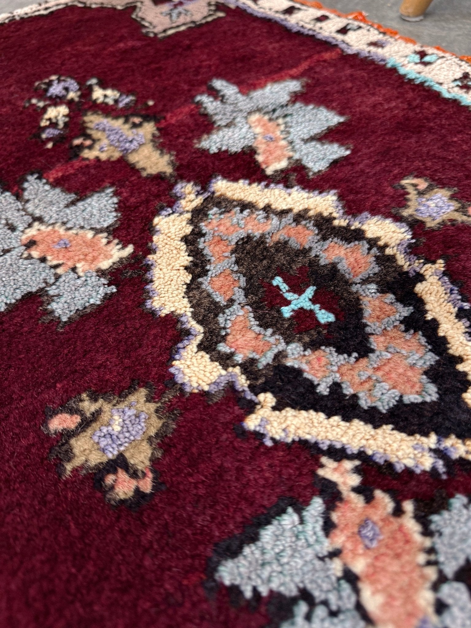 Vintage Turkish Yastik mini rug in ruby red. Hand-knotted wool, 20x33. One-of-a-kind rug from Indigo Rugs, the best rug shop in the San Francisco Bay Area (Burlingame, CA). Free shipping included.