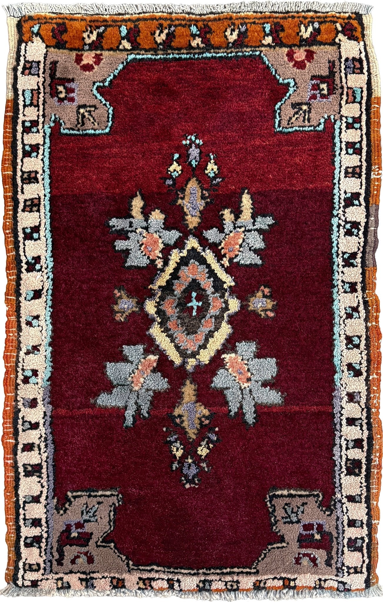 Vintage Turkish Yastik mini rug in ruby red. Hand-knotted wool, 20x33. One-of-a-kind rug from Indigo Rugs, the best rug shop in the San Francisco Bay Area (Burlingame, CA). Free shipping included.