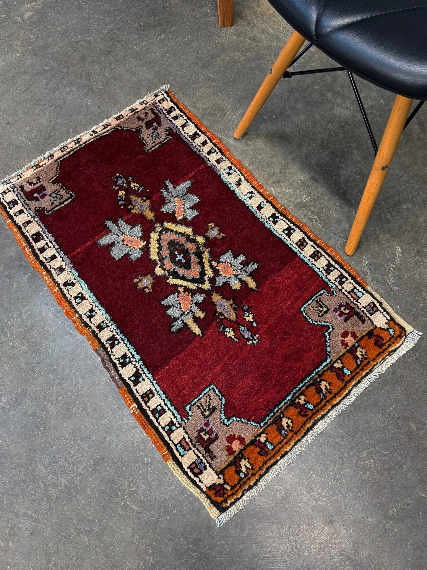 Vintage Turkish Yastik mini rug in ruby red. Hand-knotted wool, 20x33. One-of-a-kind rug from Indigo Rugs, the best rug shop in the San Francisco Bay Area (Burlingame, CA). Free shipping included.