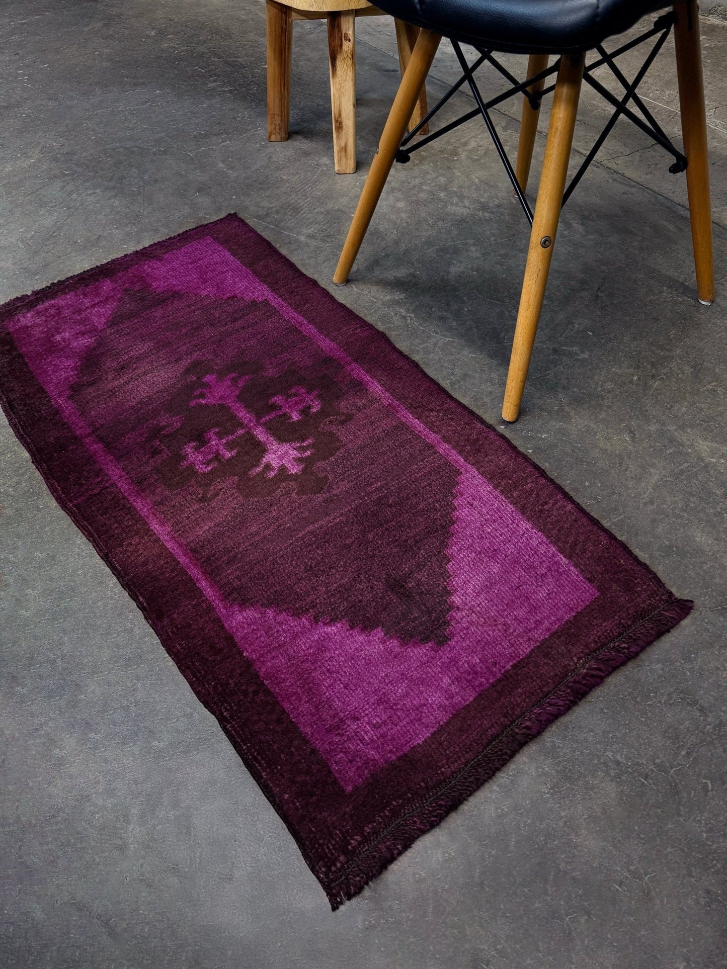 Magenta Purple Turkish mini rug with deep plum purple field, aubergine and blackberry shading, soft magenta border glow, and subtle geometric medallion. Handmade wool rug measuring 18 × 38 inches, perfect for entryways, kitchens, bedside spaces, or layered interiors.