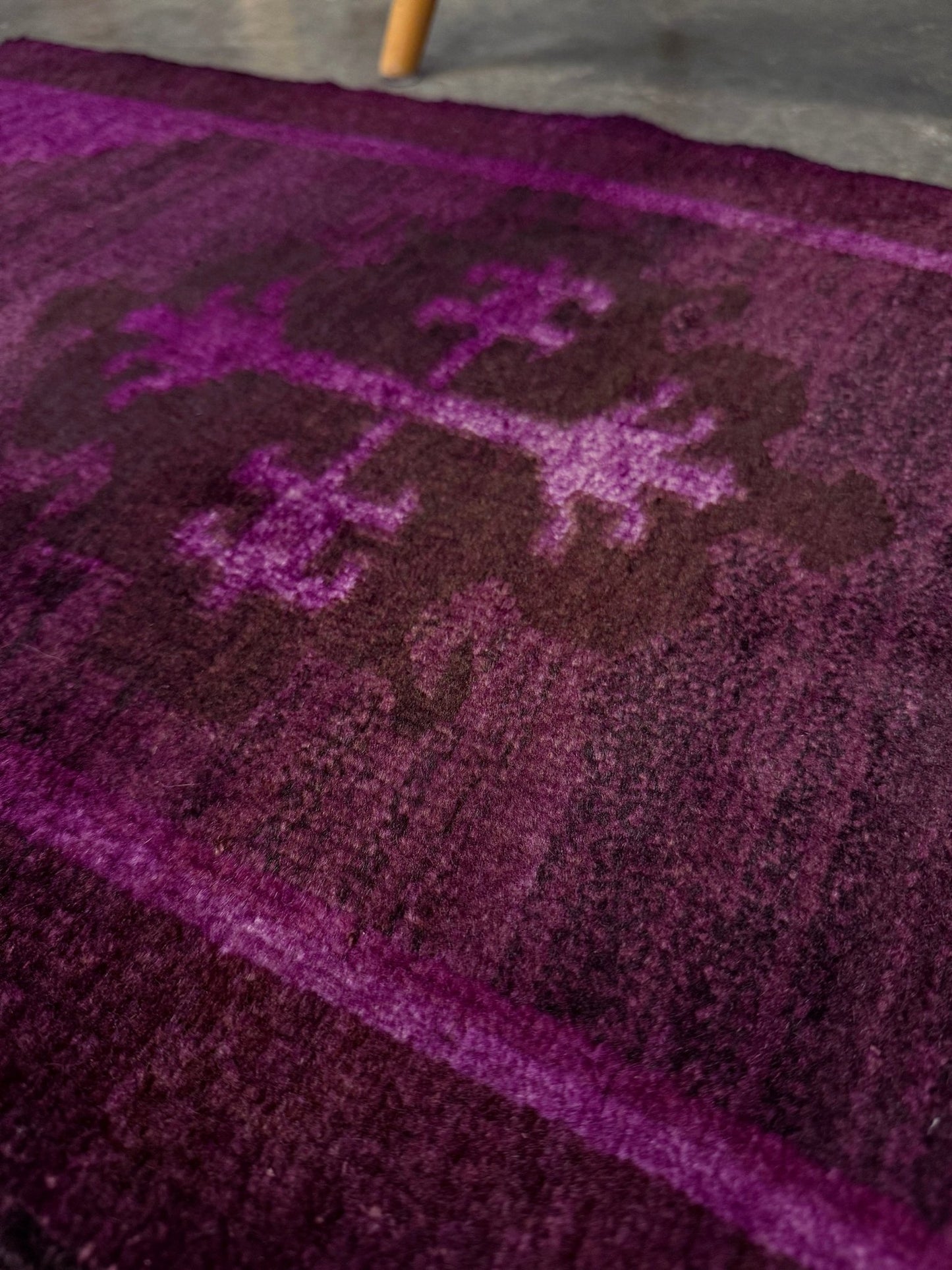 Magenta Purple Turkish mini rug with deep plum purple field, aubergine and blackberry shading, soft magenta border glow, and subtle geometric medallion. Handmade wool rug measuring 18 × 38 inches, perfect for entryways, kitchens, bedside spaces, or layered interiors.