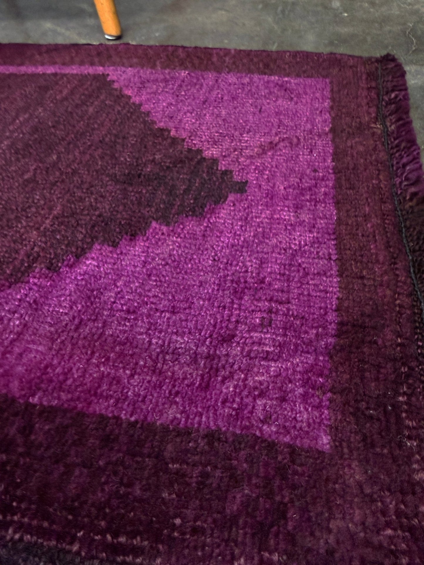 Magenta Purple Turkish mini rug with deep plum purple field, aubergine and blackberry shading, soft magenta border glow, and subtle geometric medallion. Handmade wool rug measuring 18 × 38 inches, perfect for entryways, kitchens, bedside spaces, or layered interiors.