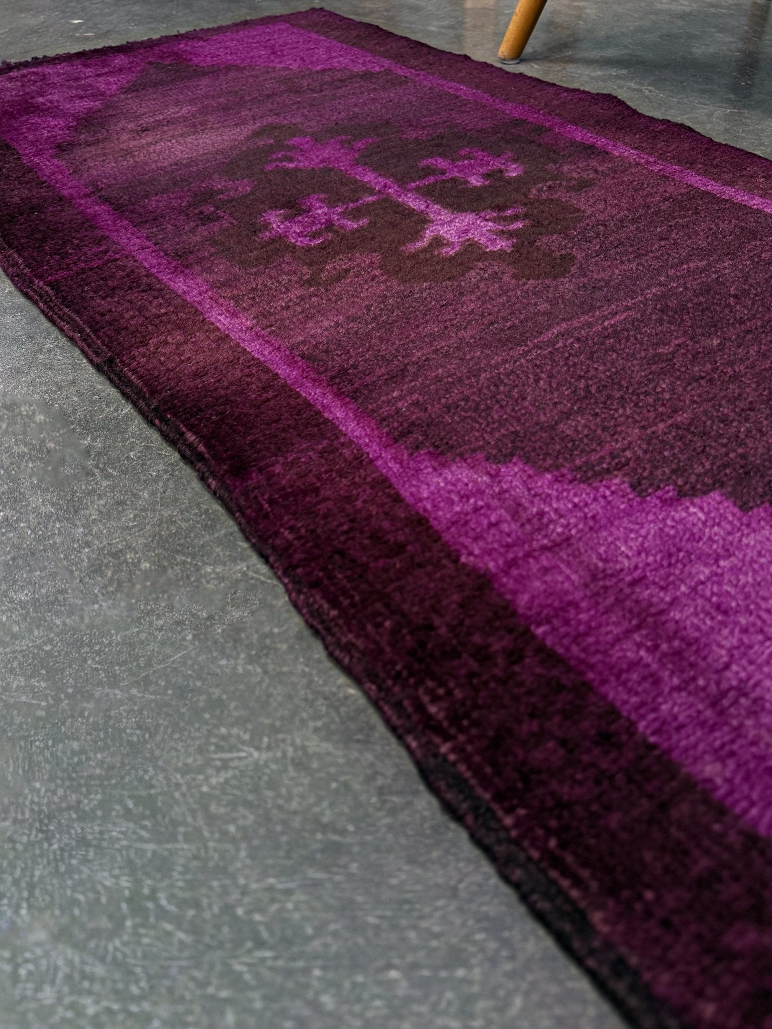 Magenta Purple Turkish mini rug with deep plum purple field, aubergine and blackberry shading, soft magenta border glow, and subtle geometric medallion. Handmade wool rug measuring 18 × 38 inches, perfect for entryways, kitchens, bedside spaces, or layered interiors.