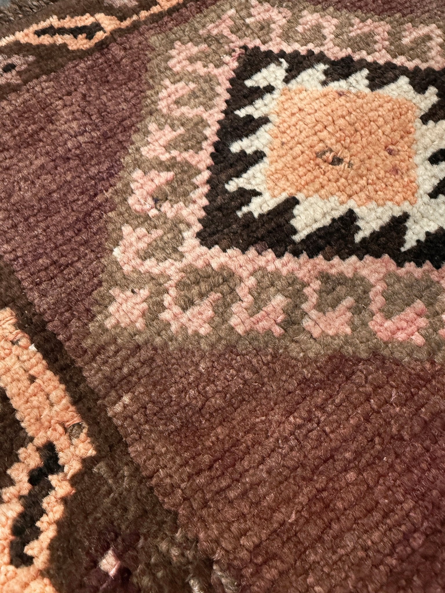Earthy mauve and brown vintage Turkish mini rug with stacked diamond medallions in peach and ivory, handmade Anatolian Yastik rug 2x3, perfect for entryway or bedside accent, kitchen.