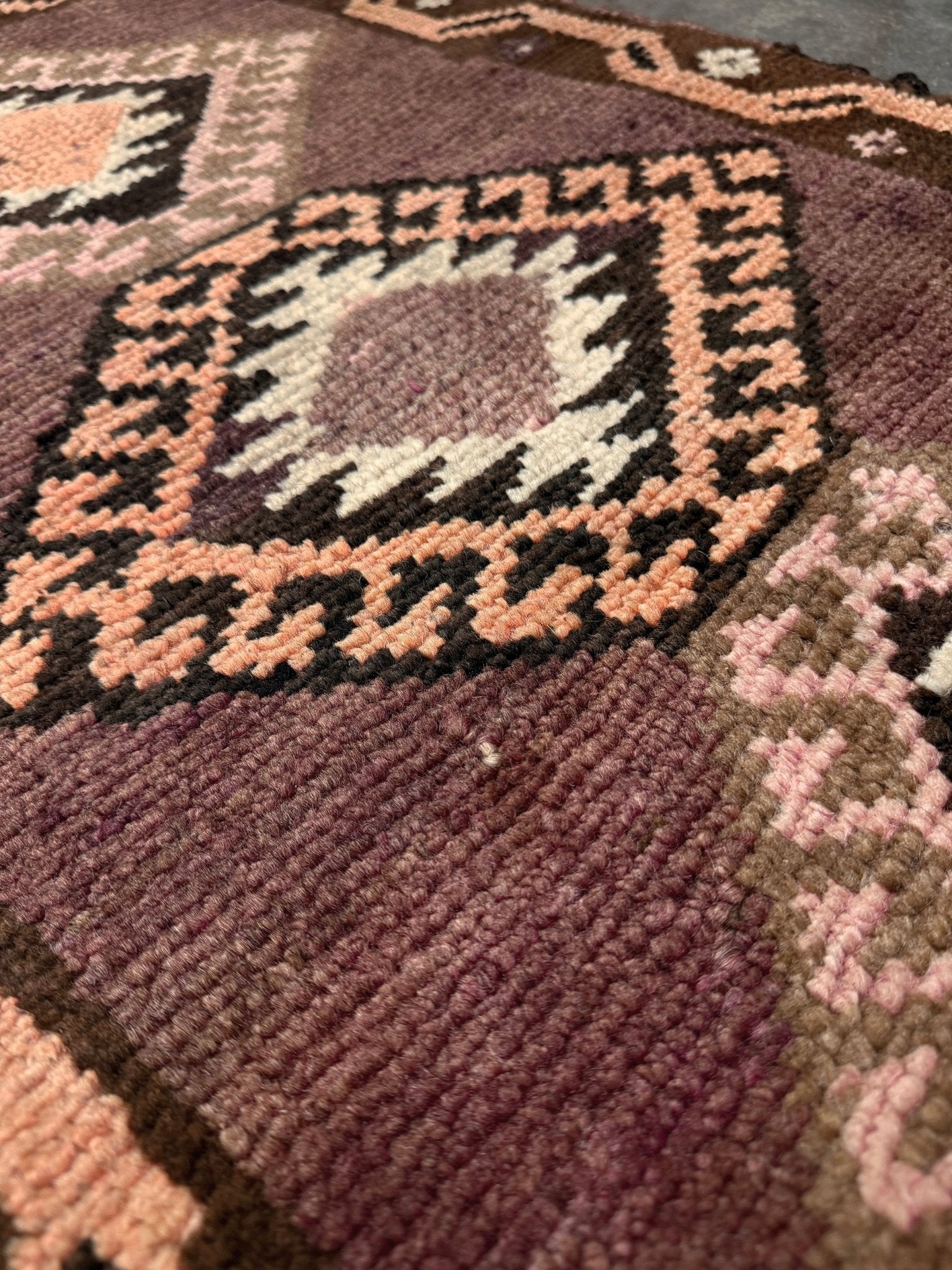 Earthy mauve and brown vintage Turkish mini rug with stacked diamond medallions in peach and ivory, handmade Anatolian Yastik rug 2x3, perfect for entryway or bedside accent, kitchen.