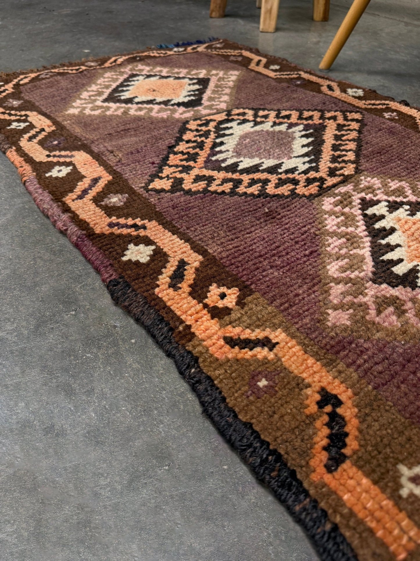 Earthy mauve and brown vintage Turkish mini rug with stacked diamond medallions in peach and ivory, handmade Anatolian Yastik rug 2x3, perfect for entryway or bedside accent, kitchen.