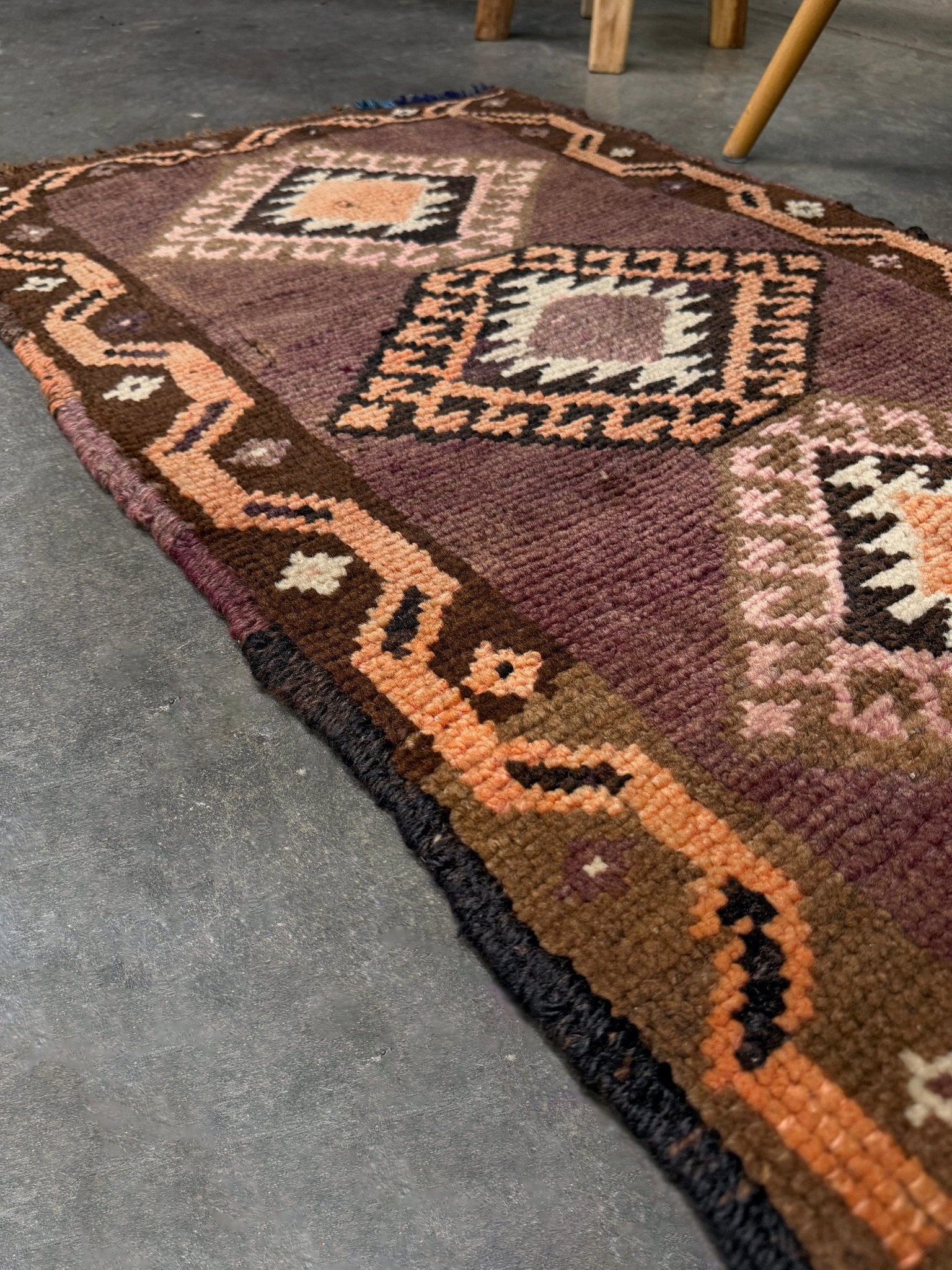 Earthy mauve and brown vintage Turkish mini rug with stacked diamond medallions in peach and ivory, handmade Anatolian Yastik rug 2x3, perfect for entryway or bedside accent, kitchen.