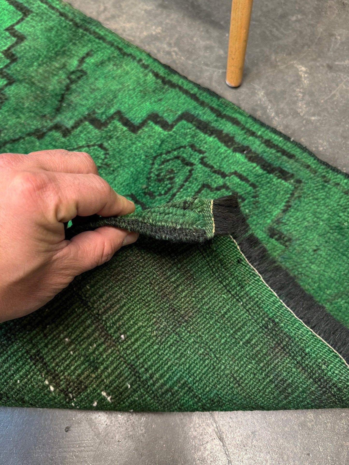 Vintage Turkish Yastik rug in emerald, forest, and moss green with espresso-black tribal outlines. Hand-knotted wool, 20x43 inches. One-of-a-kind rug from Indigo Rugs, the best rug shop in the San Francisco Bay Area (Burlingame, CA). Free shipping included.