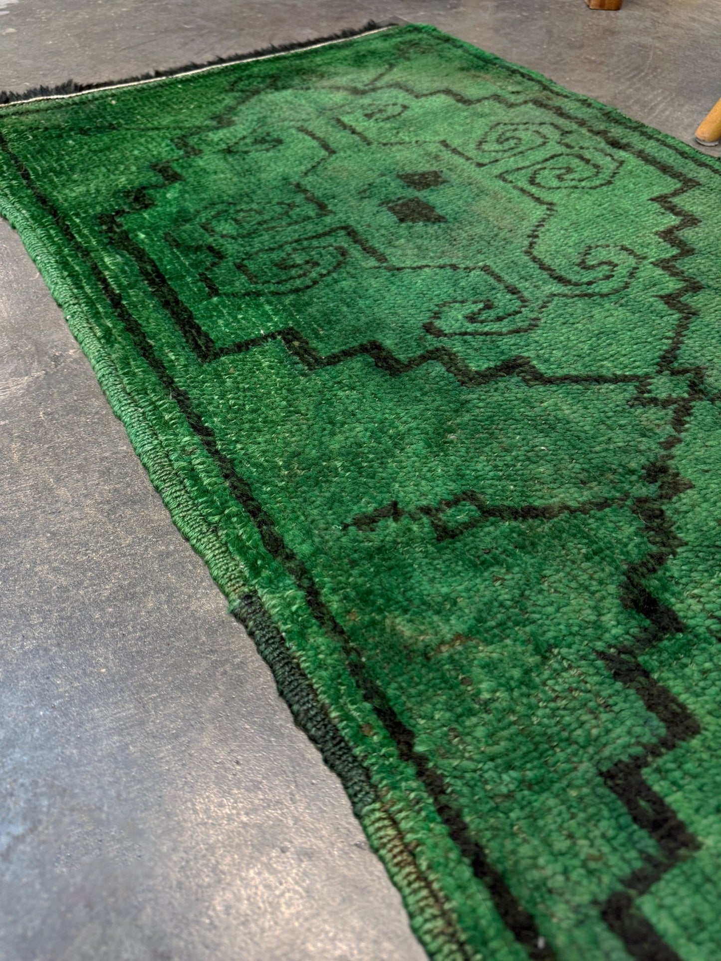 Vintage Turkish Yastik rug in emerald, forest, and moss green with espresso-black tribal outlines. Hand-knotted wool, 20x43 inches. One-of-a-kind rug from Indigo Rugs, the best rug shop in the San Francisco Bay Area (Burlingame, CA). Free shipping included.