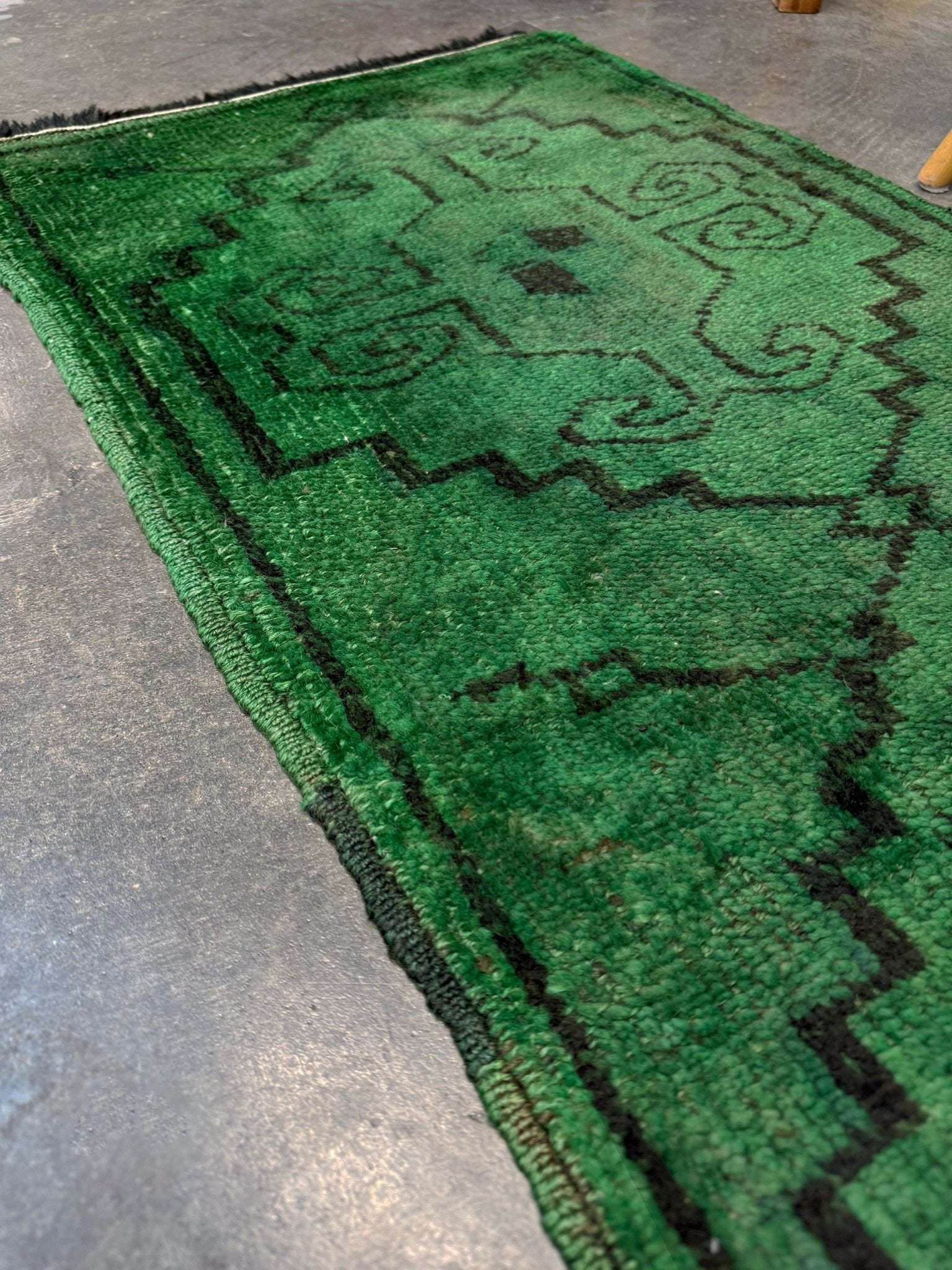 Vintage Turkish Yastik rug in emerald, forest, and moss green with espresso-black tribal outlines. Hand-knotted wool, 20x43 inches. One-of-a-kind rug from Indigo Rugs, the best rug shop in the San Francisco Bay Area (Burlingame, CA). Free shipping included.