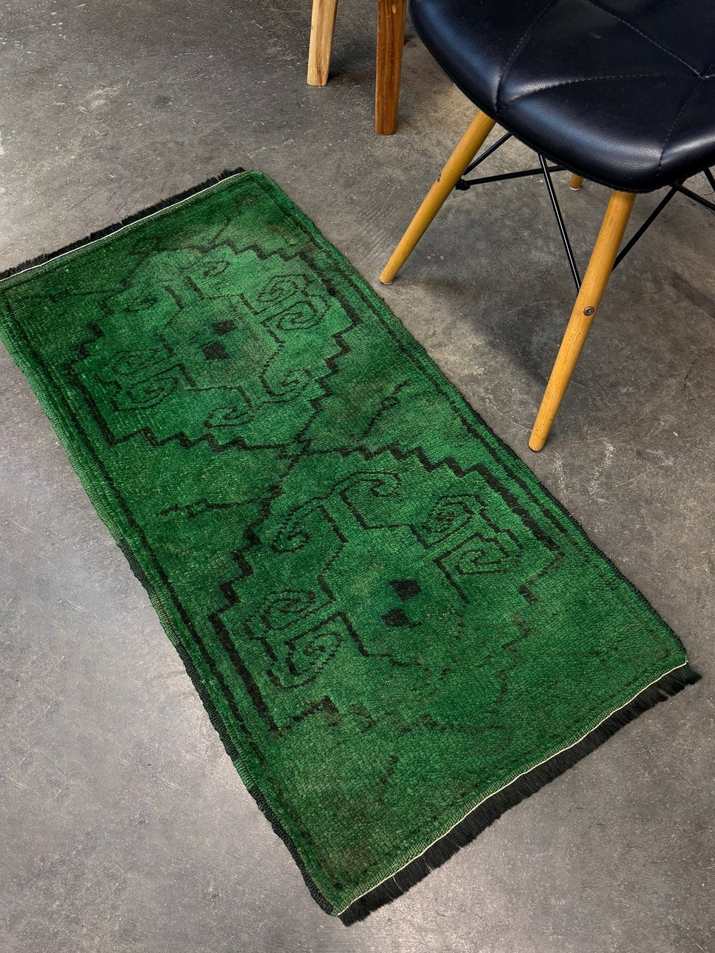 Vintage Turkish Yastik rug in emerald, forest, and moss green with espresso-black tribal outlines. Hand-knotted wool, 20x43 inches. One-of-a-kind rug from Indigo Rugs, the best rug shop in the San Francisco Bay Area (Burlingame, CA). Free shipping included.