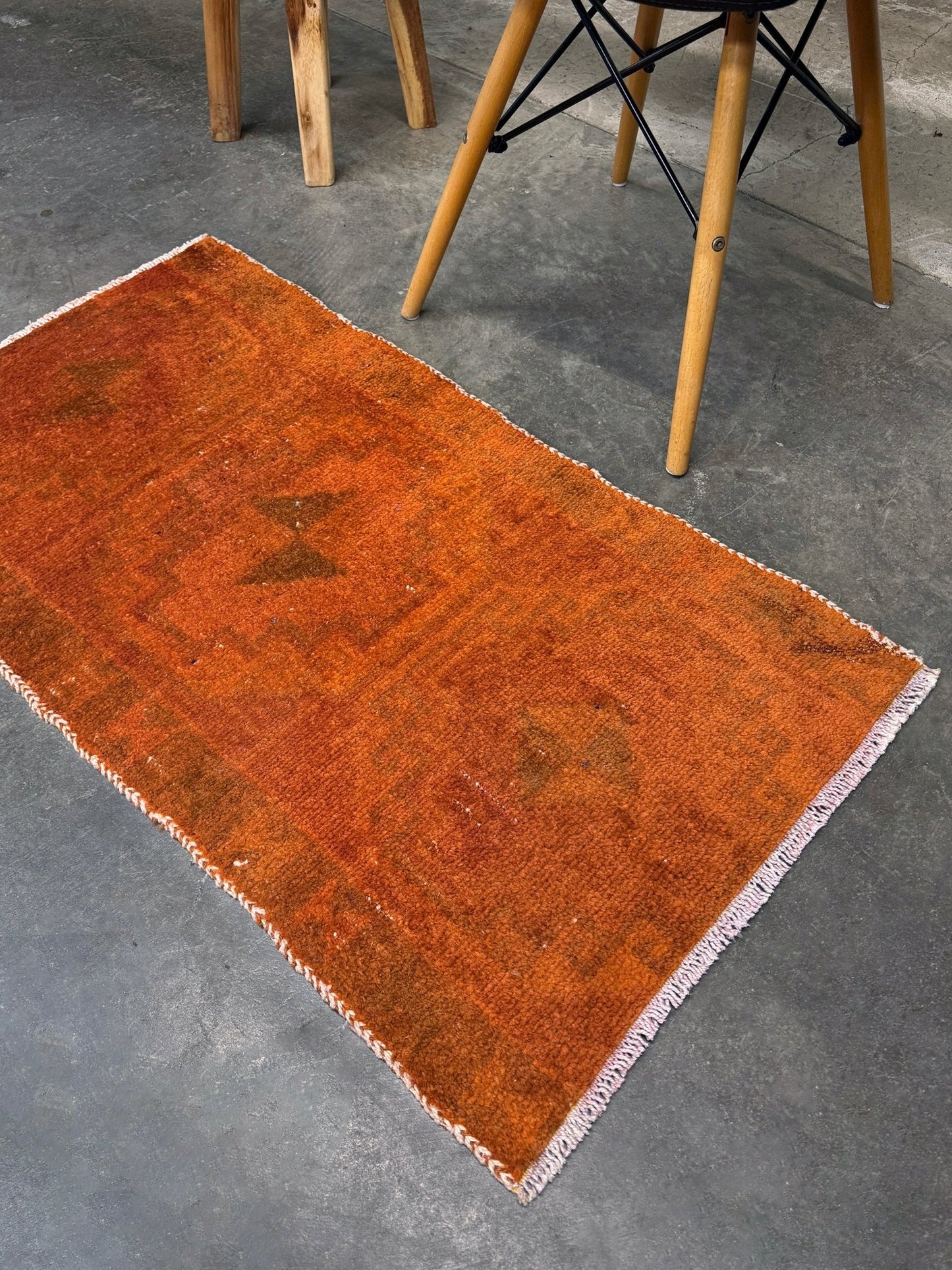 Vintage terracotta orange  abstract transitional Turkish mini rug 21x39 with subtle tonal variations and minimalist design, handmade wool rug from Indigo Rugs in Burlingame, San Francisco Bay Area. Doormat bathmat perfect foe entry doorway kitchen. Free shipping.
