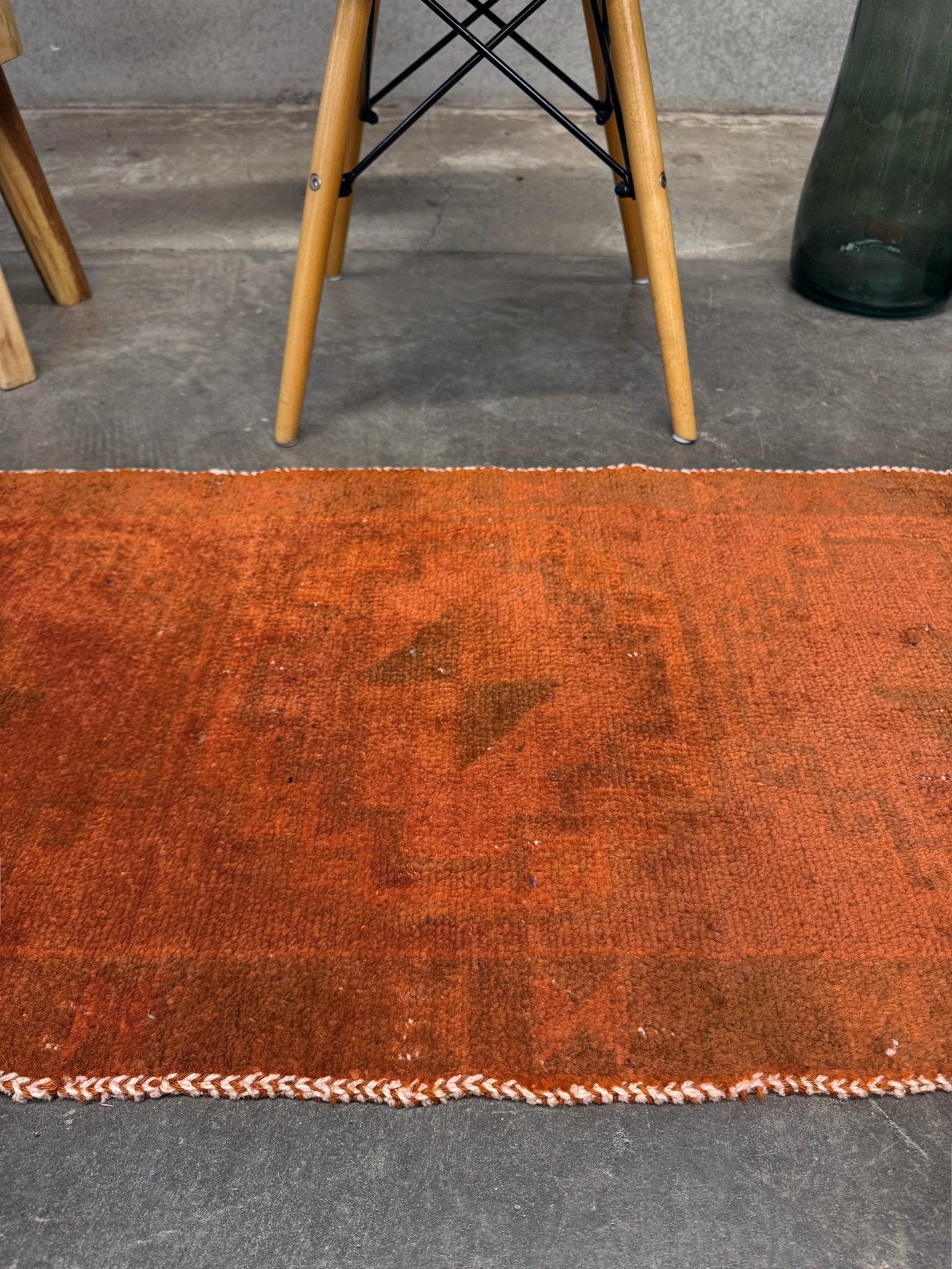 Vintage terracotta orange  abstract transitional Turkish mini rug 21x39 with subtle tonal variations and minimalist design, handmade wool rug from Indigo Rugs in Burlingame, San Francisco Bay Area. Doormat bathmat perfect foe entry doorway kitchen. Free shipping.