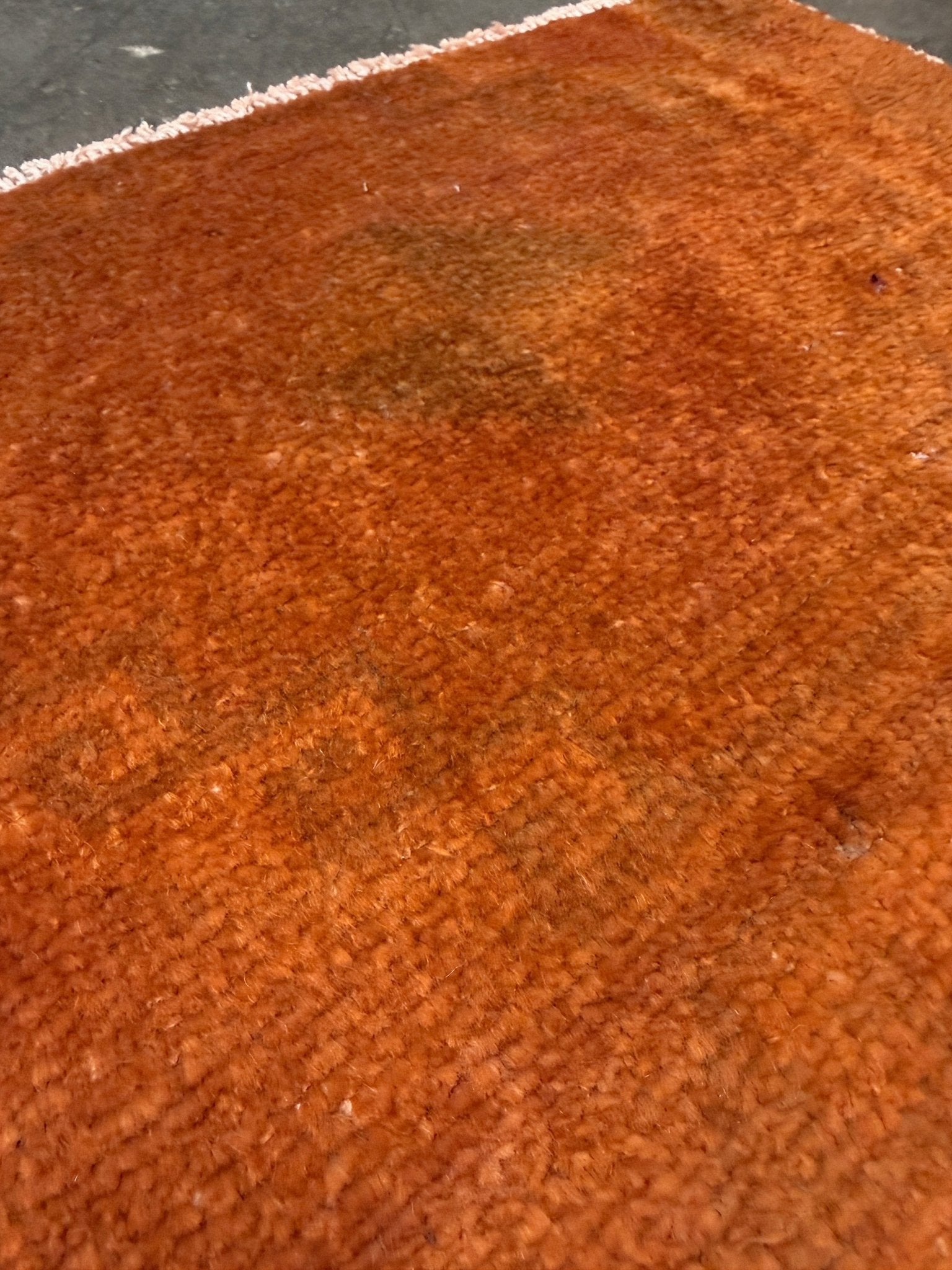 Vintage terracotta orange  abstract transitional Turkish mini rug 21x39 with subtle tonal variations and minimalist design, handmade wool rug from Indigo Rugs in Burlingame, San Francisco Bay Area. Doormat bathmat perfect foe entry doorway kitchen. Free shipping.