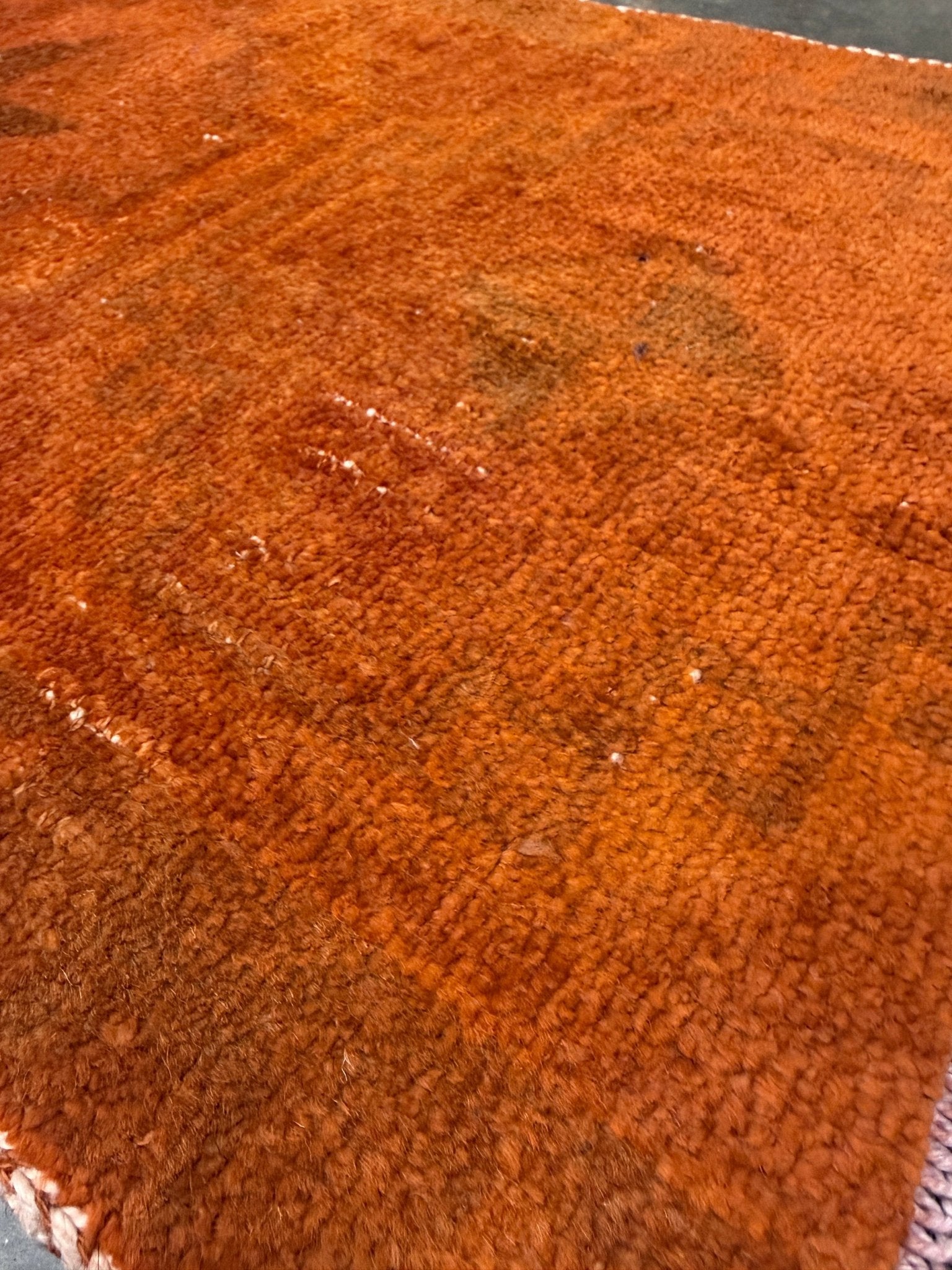 Vintage terracotta orange  abstract transitional Turkish mini rug 21x39 with subtle tonal variations and minimalist design, handmade wool rug from Indigo Rugs in Burlingame, San Francisco Bay Area. Doormat bathmat perfect foe entry doorway kitchen. Free shipping.