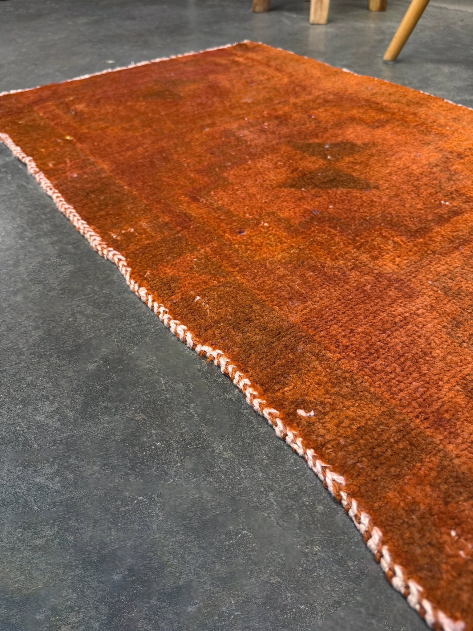 Vintage terracotta orange  abstract transitional Turkish mini rug 21x39 with subtle tonal variations and minimalist design, handmade wool rug from Indigo Rugs in Burlingame, San Francisco Bay Area. Doormat bathmat perfect foe entry doorway kitchen. Free shipping.