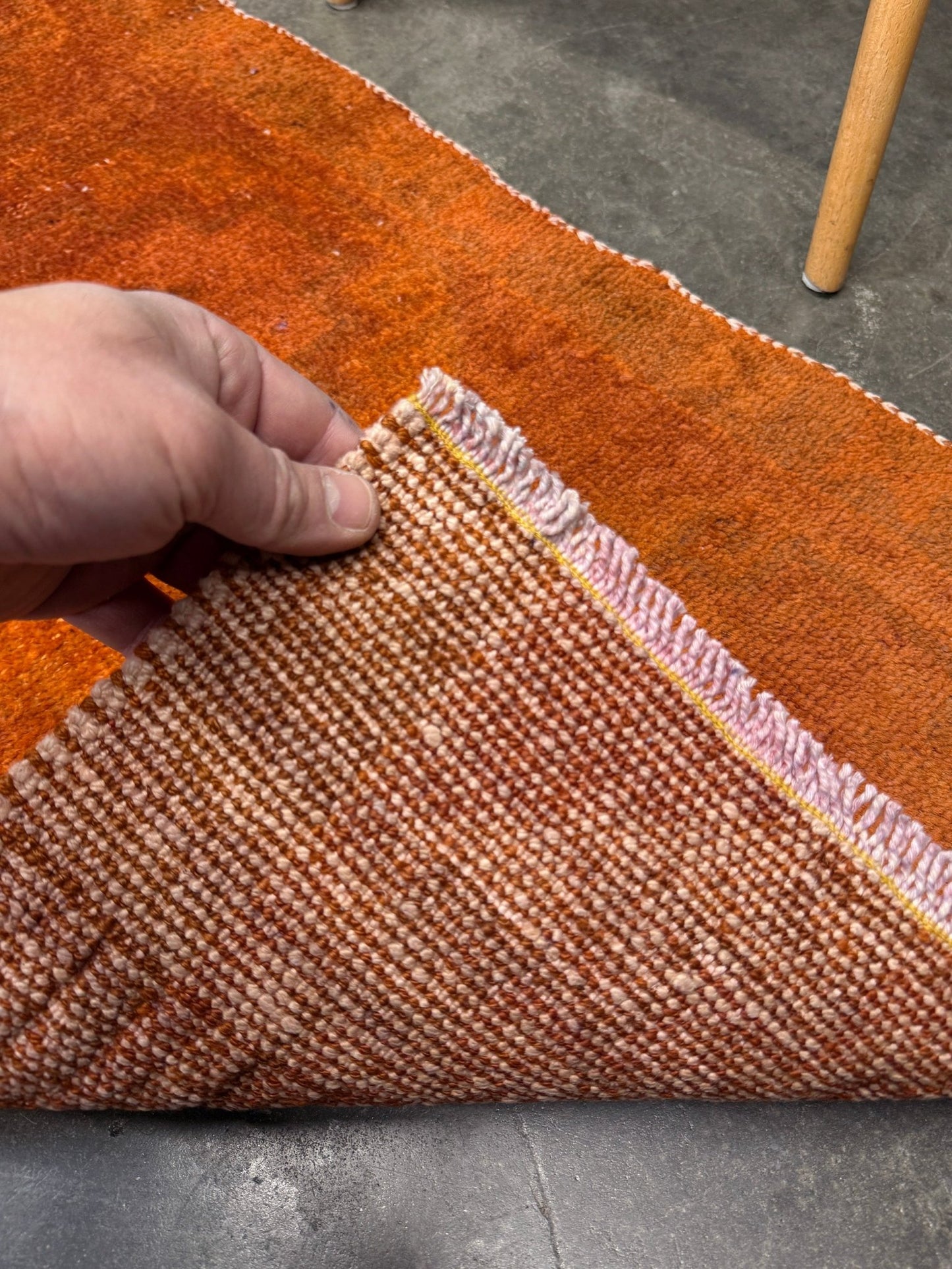 Vintage terracotta orange  abstract transitional Turkish mini rug 21x39 with subtle tonal variations and minimalist design, handmade wool rug from Indigo Rugs in Burlingame, San Francisco Bay Area. Doormat bathmat perfect foe entry doorway kitchen. Free shipping.