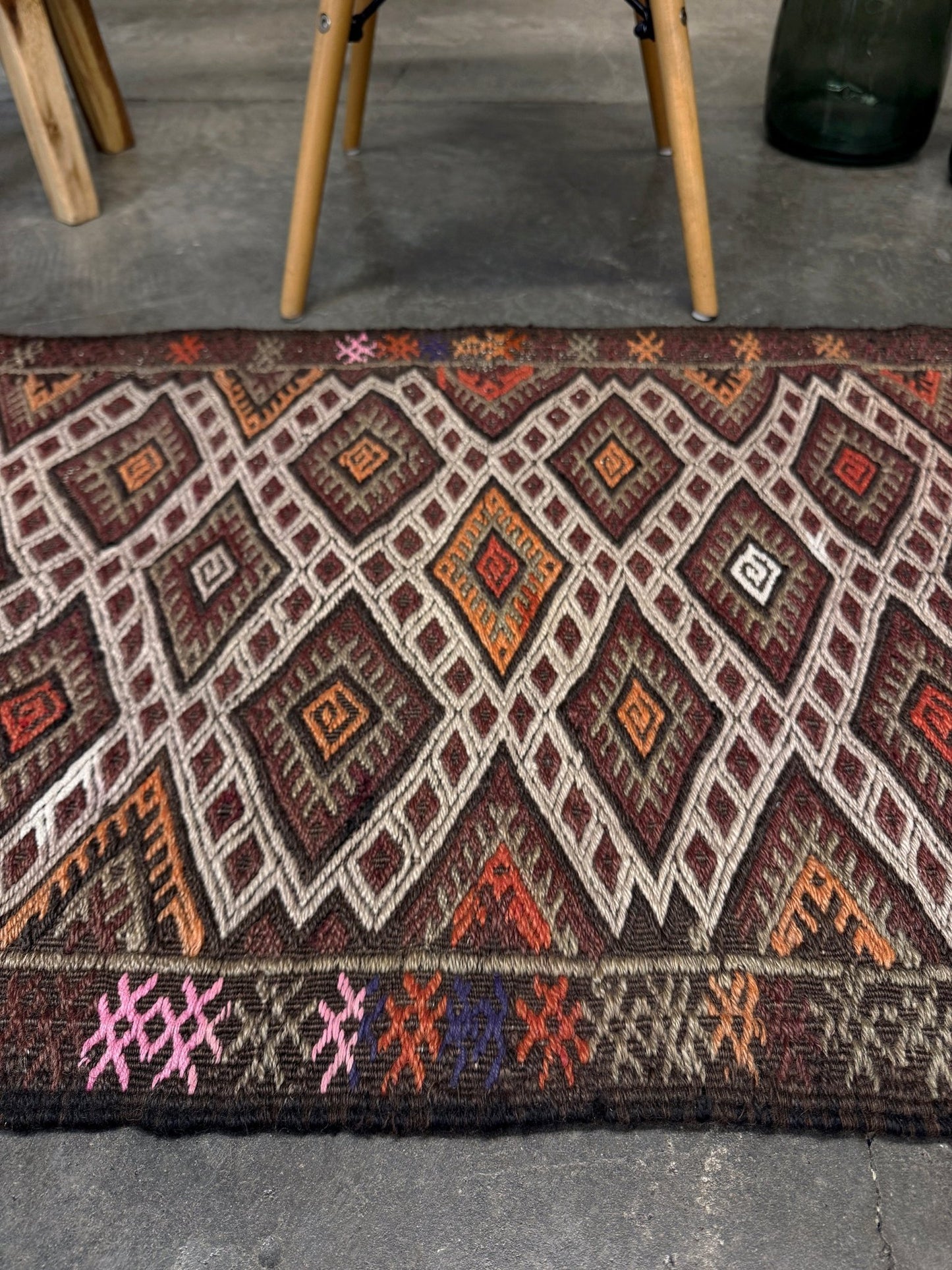 Vintage Turkish cicim embroidered mini kilim rug in earth brown with geometric diamond lattice motifs, tribal handmade flatweave wool accent rug 23x38 from Indigo Rugs Burlingame Bay Area.