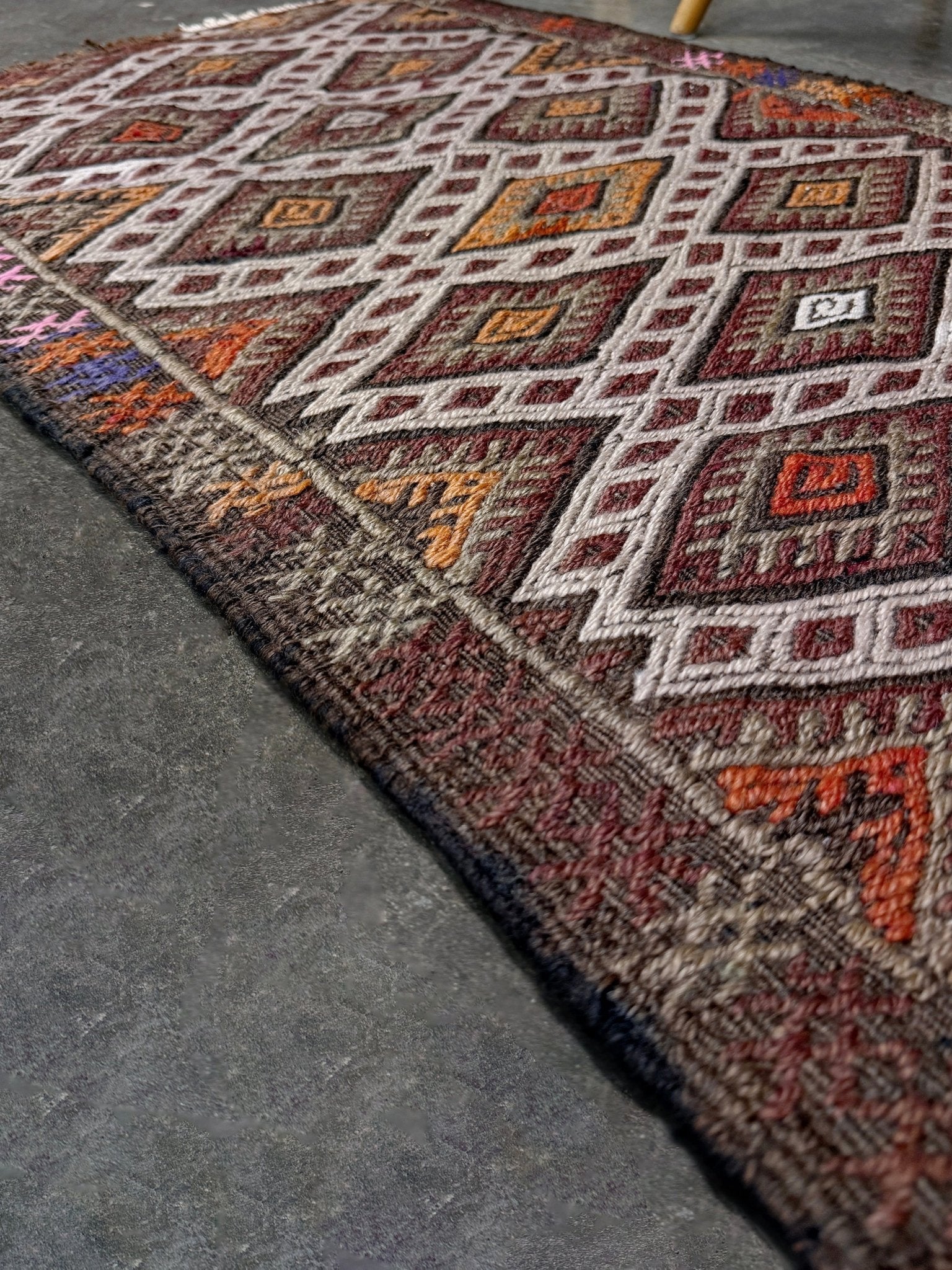 Vintage Turkish cicim embroidered mini kilim rug in earth brown with geometric diamond lattice motifs, tribal handmade flatweave wool accent rug 23x38 from Indigo Rugs Burlingame Bay Area.