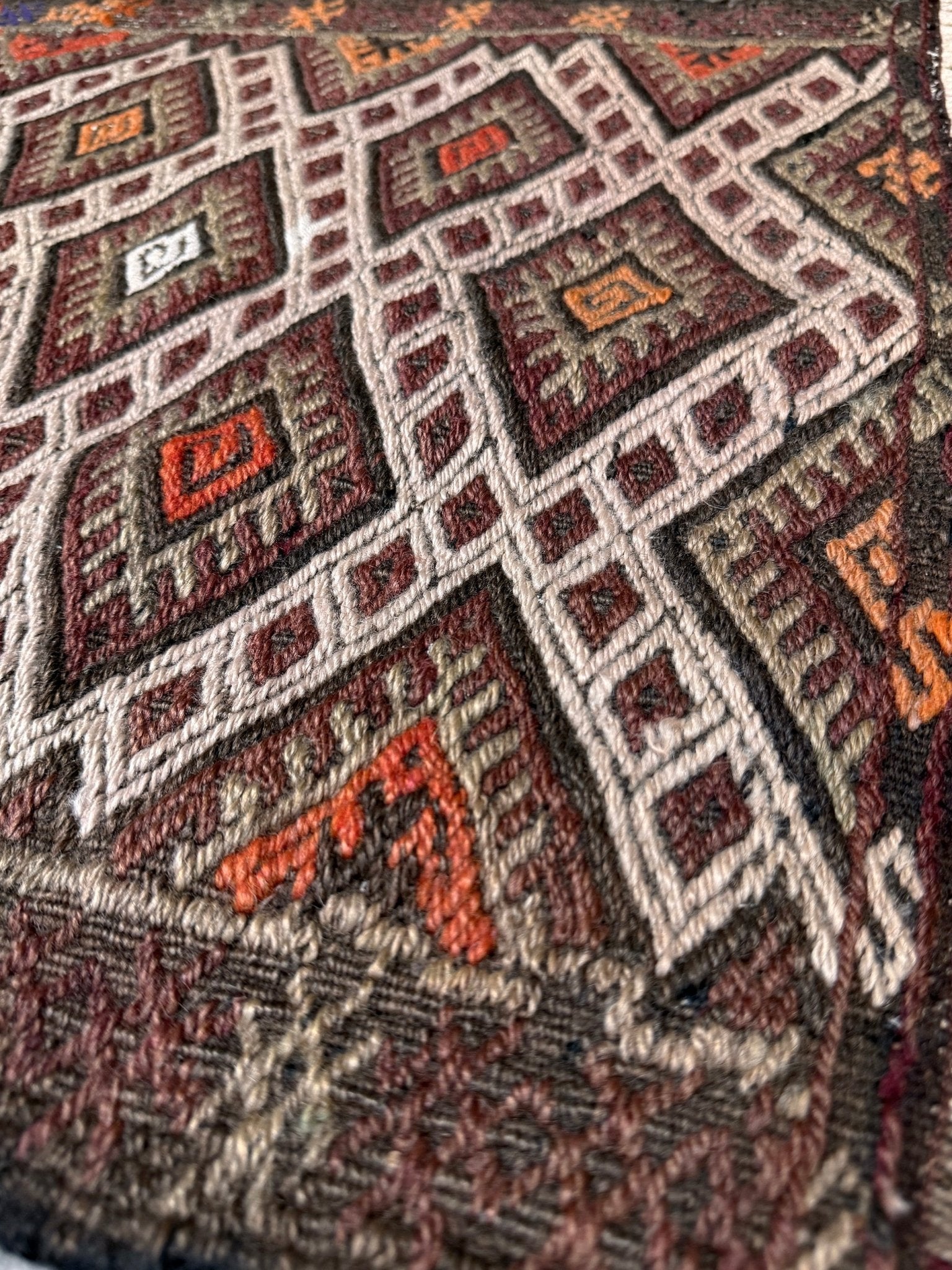 Vintage Turkish cicim embroidered mini kilim rug in earth brown with geometric diamond lattice motifs, tribal handmade flatweave wool accent rug 23x38 from Indigo Rugs Burlingame Bay Area.