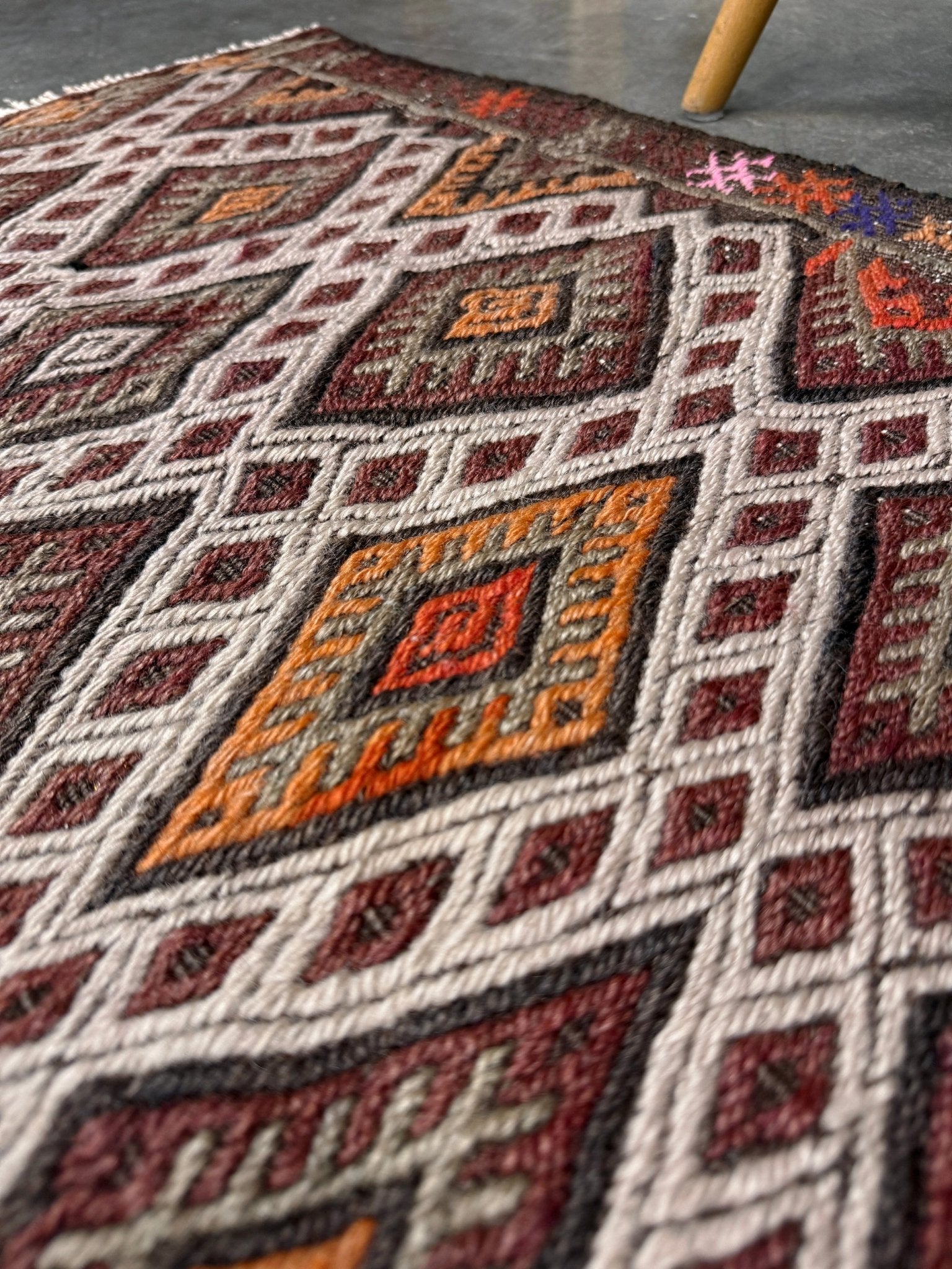 Vintage Turkish cicim embroidered mini kilim rug in earth brown with geometric diamond lattice motifs, tribal handmade flatweave wool accent rug 23x38 from Indigo Rugs Burlingame Bay Area.
