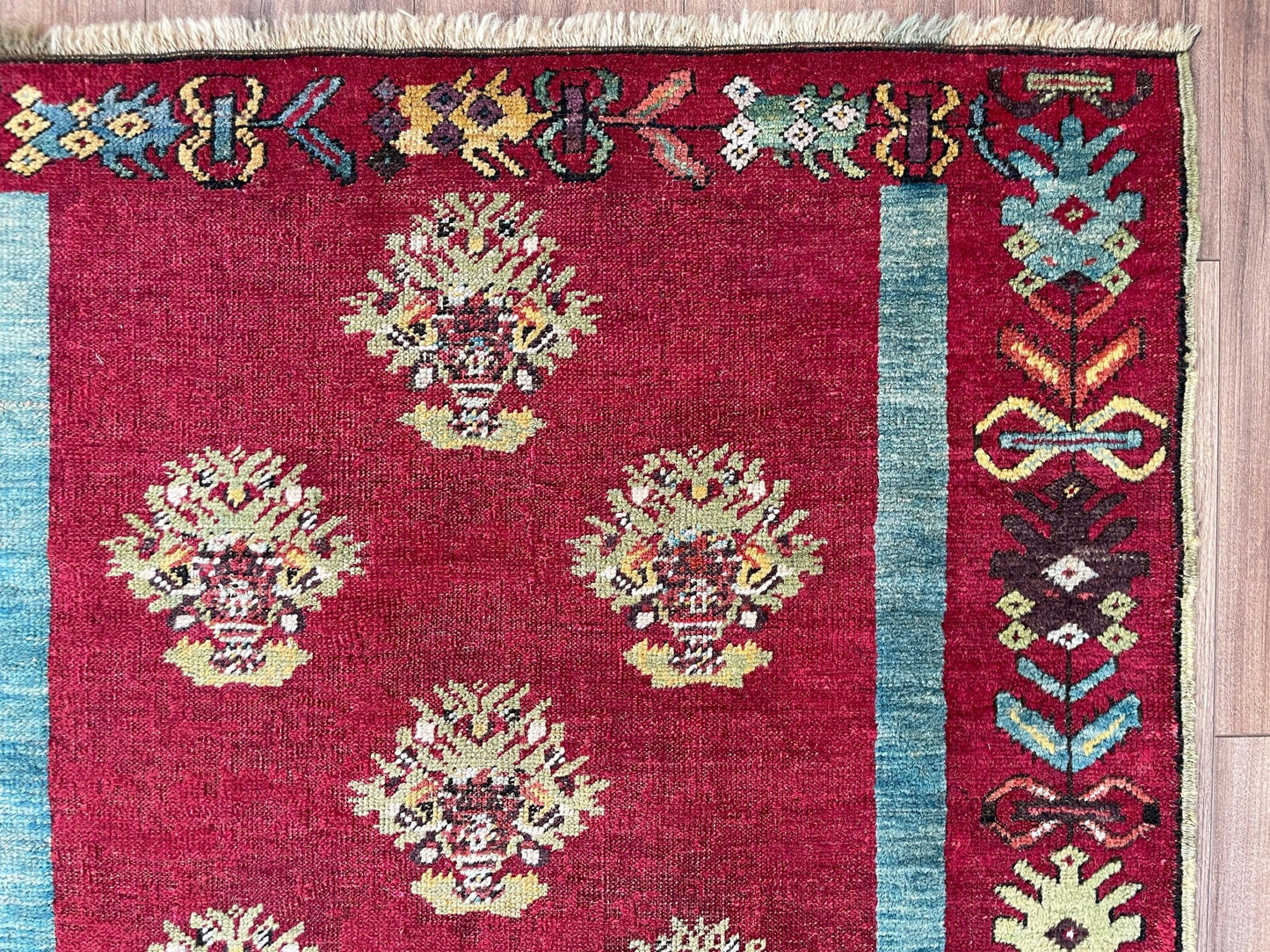 mucur Vintage Turkish rug shop san francisco bay area. antique prayer soft red rug, bold color store, local rug shop