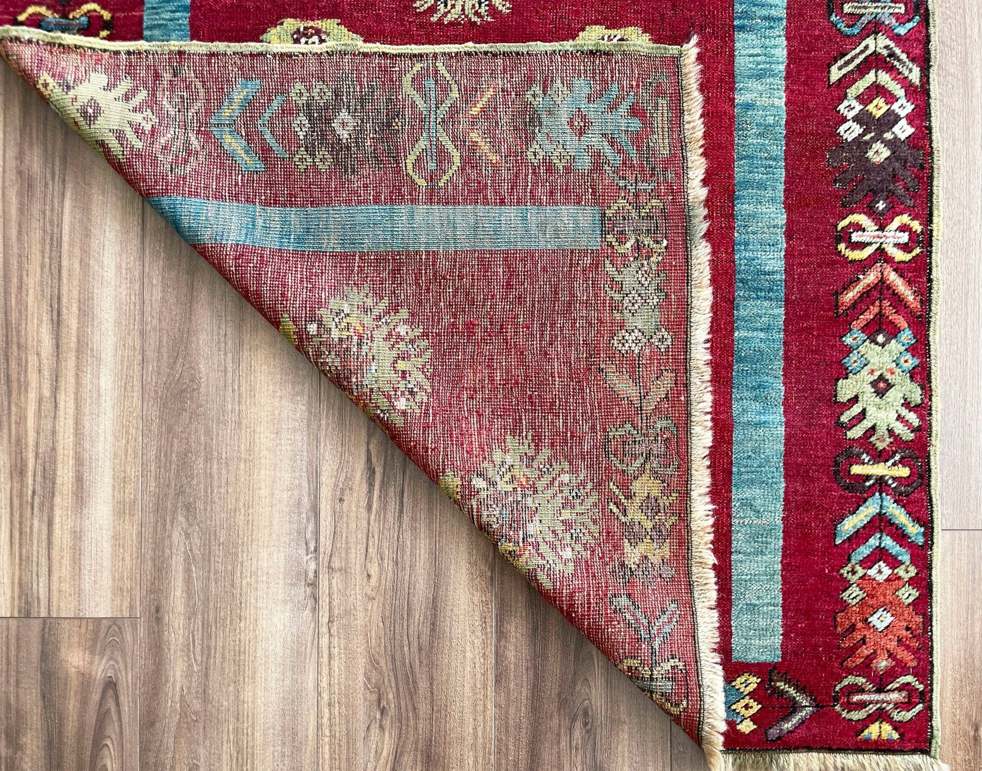 mucur Vintage Turkish rug shop san francisco bay area. antique prayer soft red rug, bold color store, local rug shop
