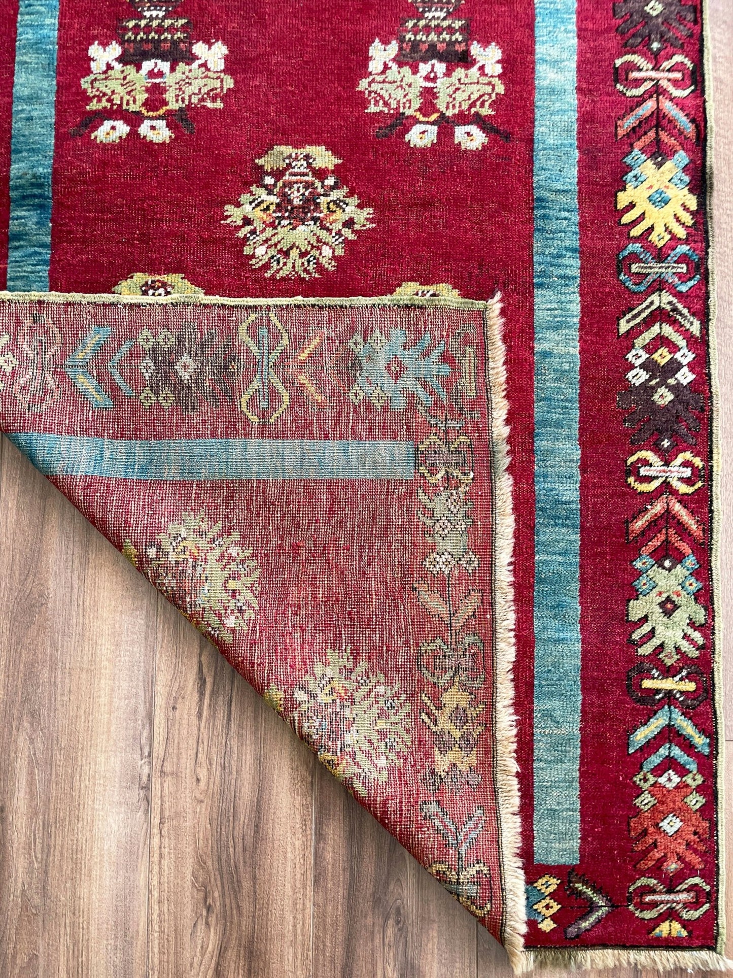 mucur Vintage Turkish rug shop san francisco bay area. antique prayer soft red rug, bold color store, local rug shop