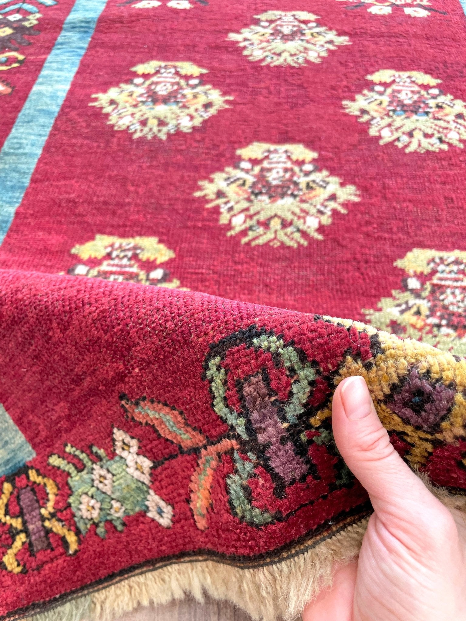 mucur Vintage Turkish rug shop san francisco bay area. antique prayer soft red rug, bold color store, local rug shop