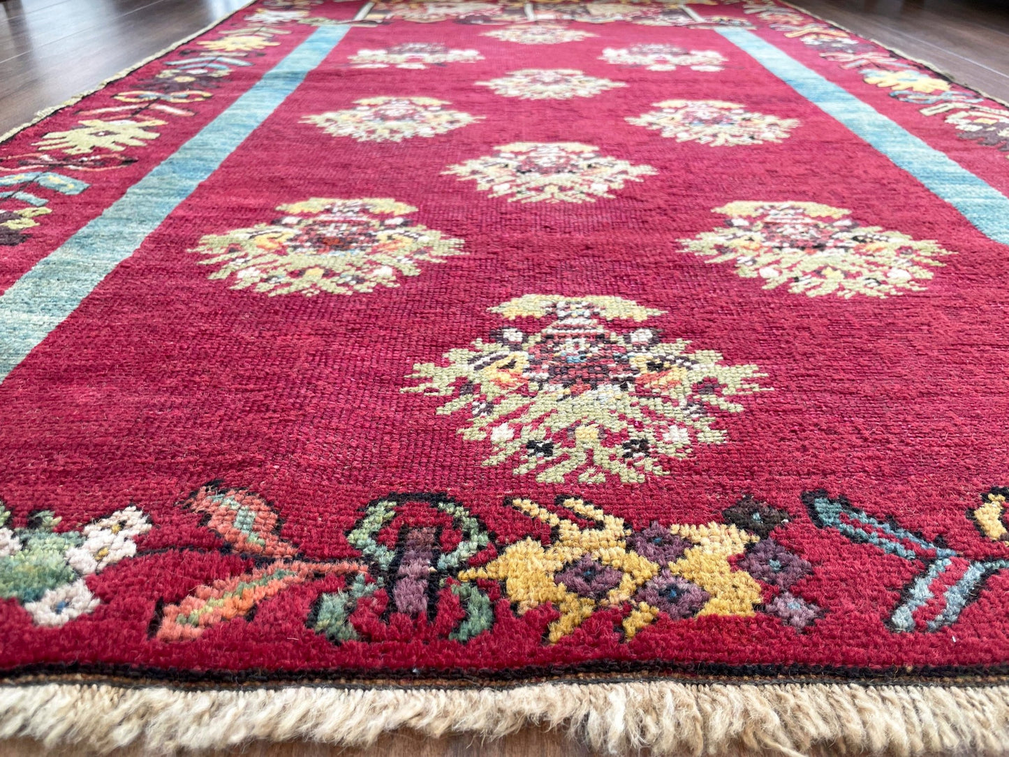 mucur Vintage Turkish rug shop san francisco bay area. antique prayer soft red rug, bold color store, local rug shop