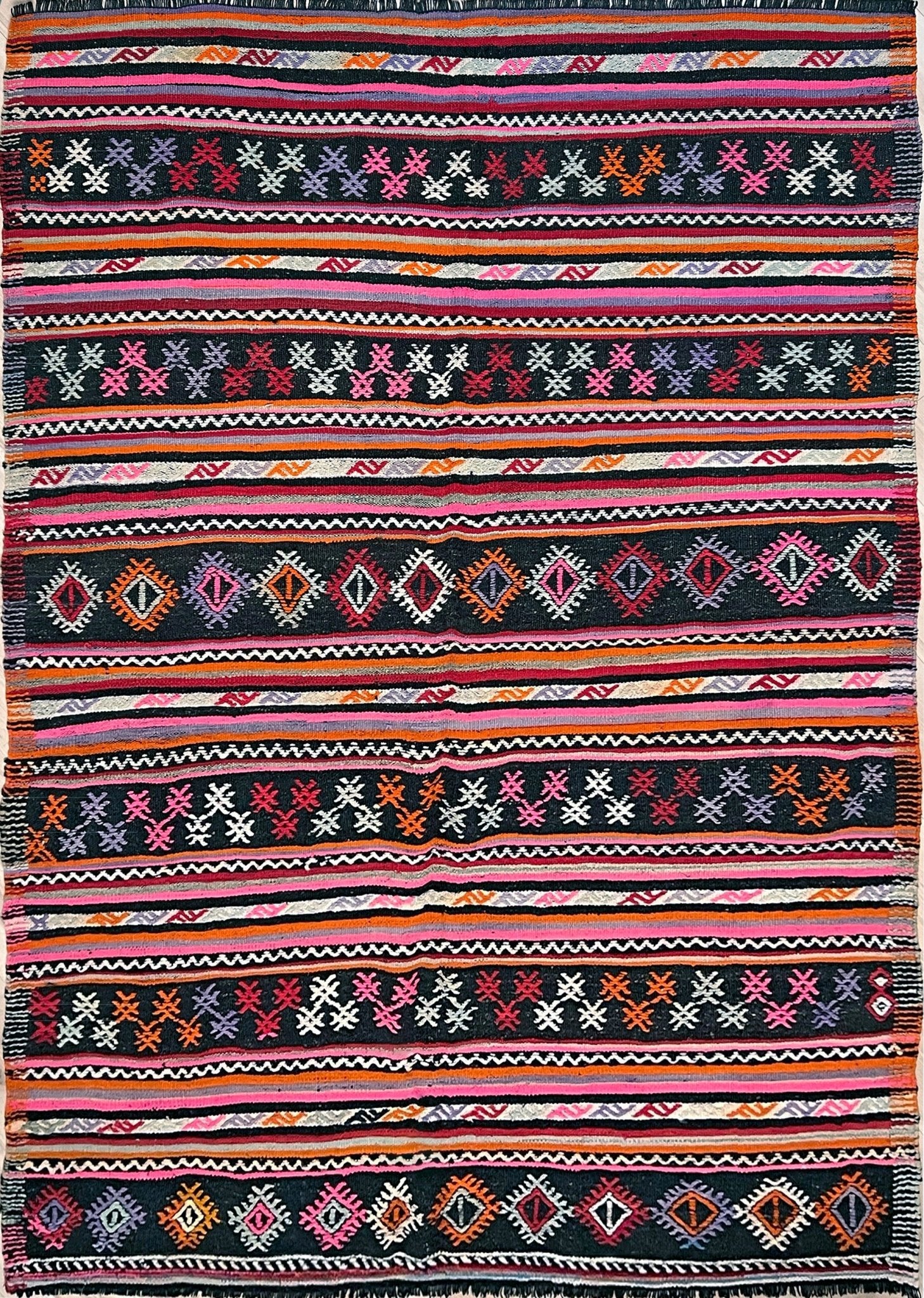 Pink striped Turkish kilim rug shop berkeley. Handmade rug San Francisco bay area. Vibrant color handmade wool rug. 