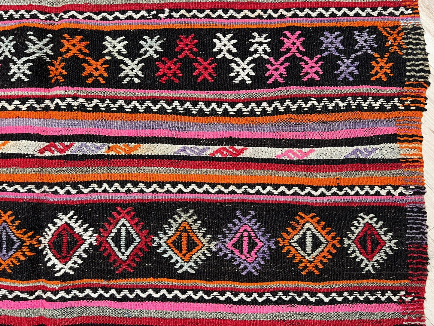 Pink striped Turkish kilim rug shop berkeley. Handmade rug San Francisco bay area. Vibrant color handmade wool rug. 